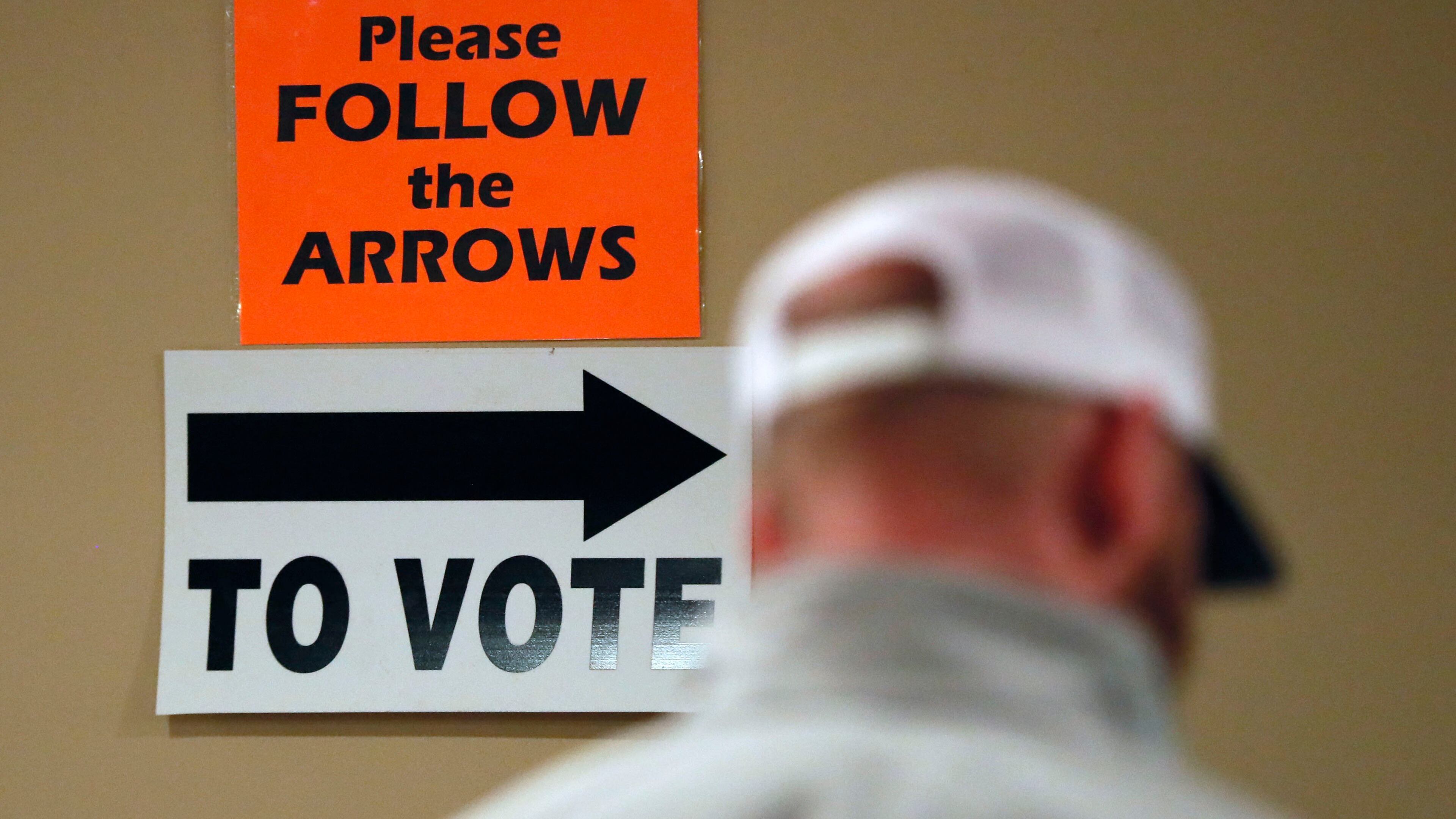 A steady steam of people vote at the St Mary’s Orthodox Church in Roswell. BOB ANDRES / BANDRES@AJC.COM