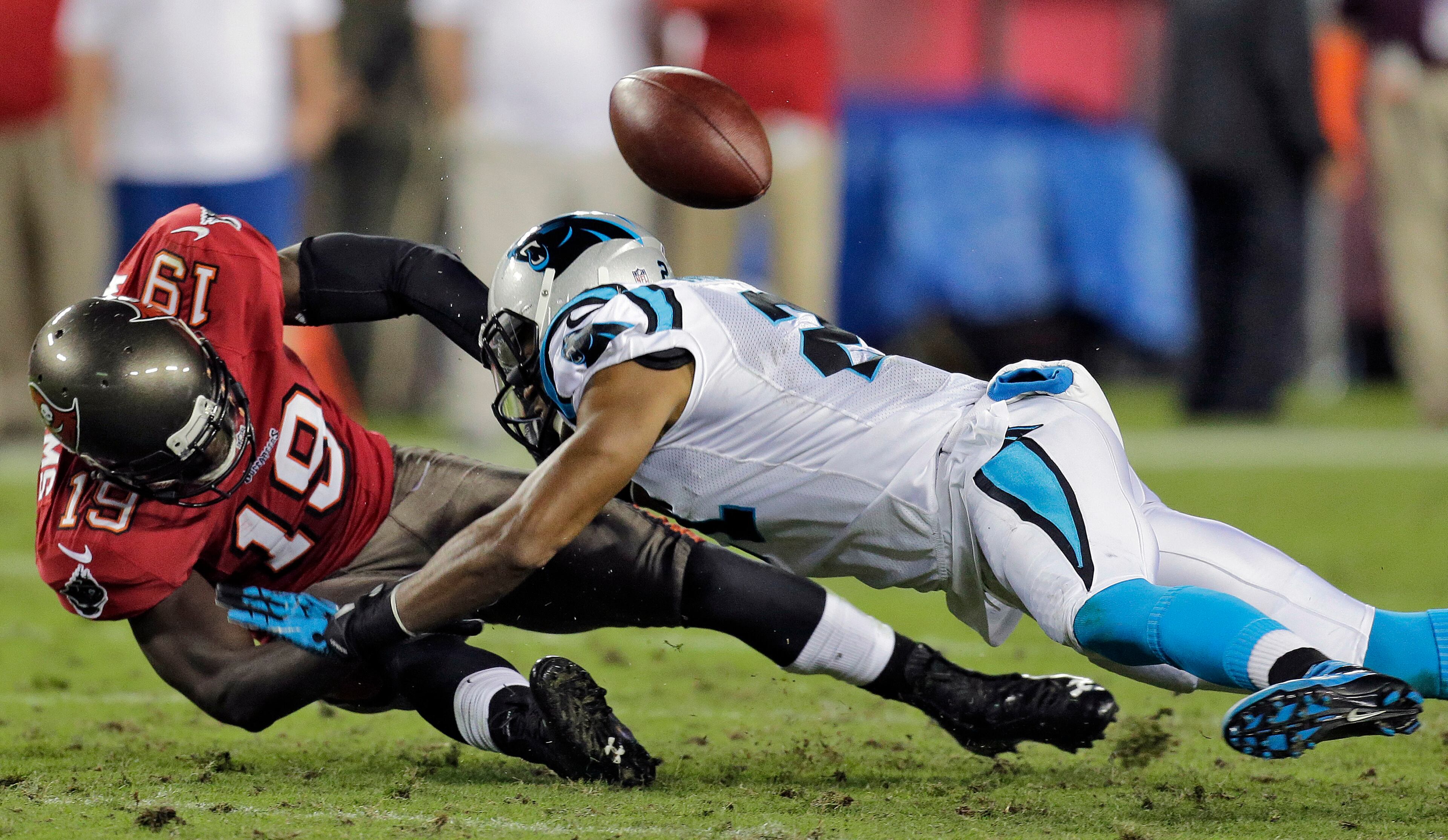 Tampa Bay Buccaneers wide receiver Mike Williams (19) loses the ball as he is hit by Carolina Panthers free safety Mike Mitchell, right, during the third quarter of an NFL football game in Tampa, Fla, on Thursday, Oct. 24. The Carolina Panthers beat the Tampa Bay Buccaneers 31-13. Mitchell says he�s being �targeted� by NFL commissioner Roger Goodell for no reason. Mitchell said he�s been fined five times already this year by the league, the latest coming for taunting Sam Bradford after shoving Rams quarterback out of bounds and injuring his knee in a game on Oct. 20 in Charlotte. (AP Photo/Chris O'Meara, File)