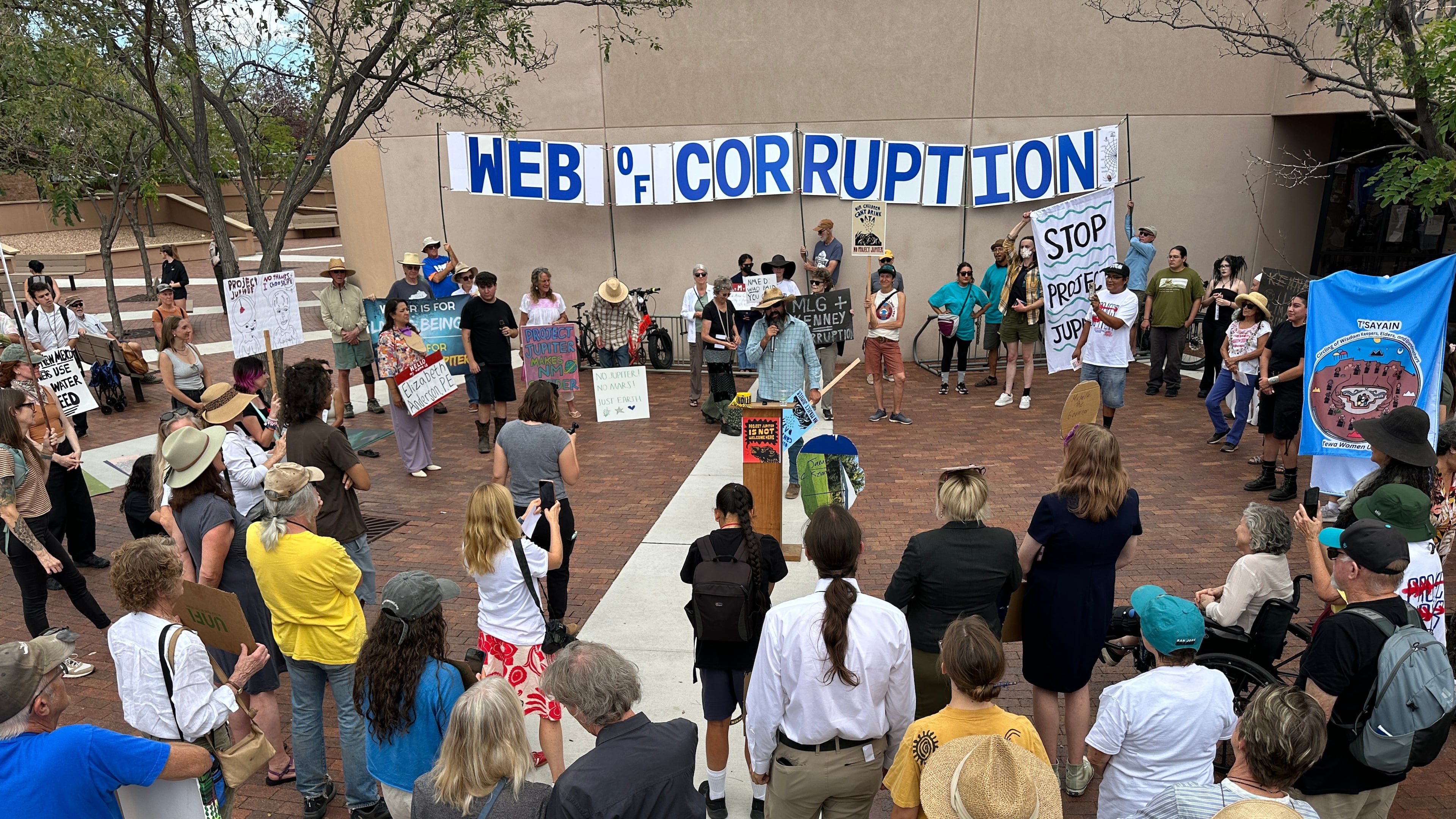 Protesters gather outside the New Mexico Environment Department to voice opposition to the Project Jupiter data center during a demonstration in Santa Fe, N.M., Friday, Aug. 21, 2026. (AP Photo/Susan Montoya Bryan)