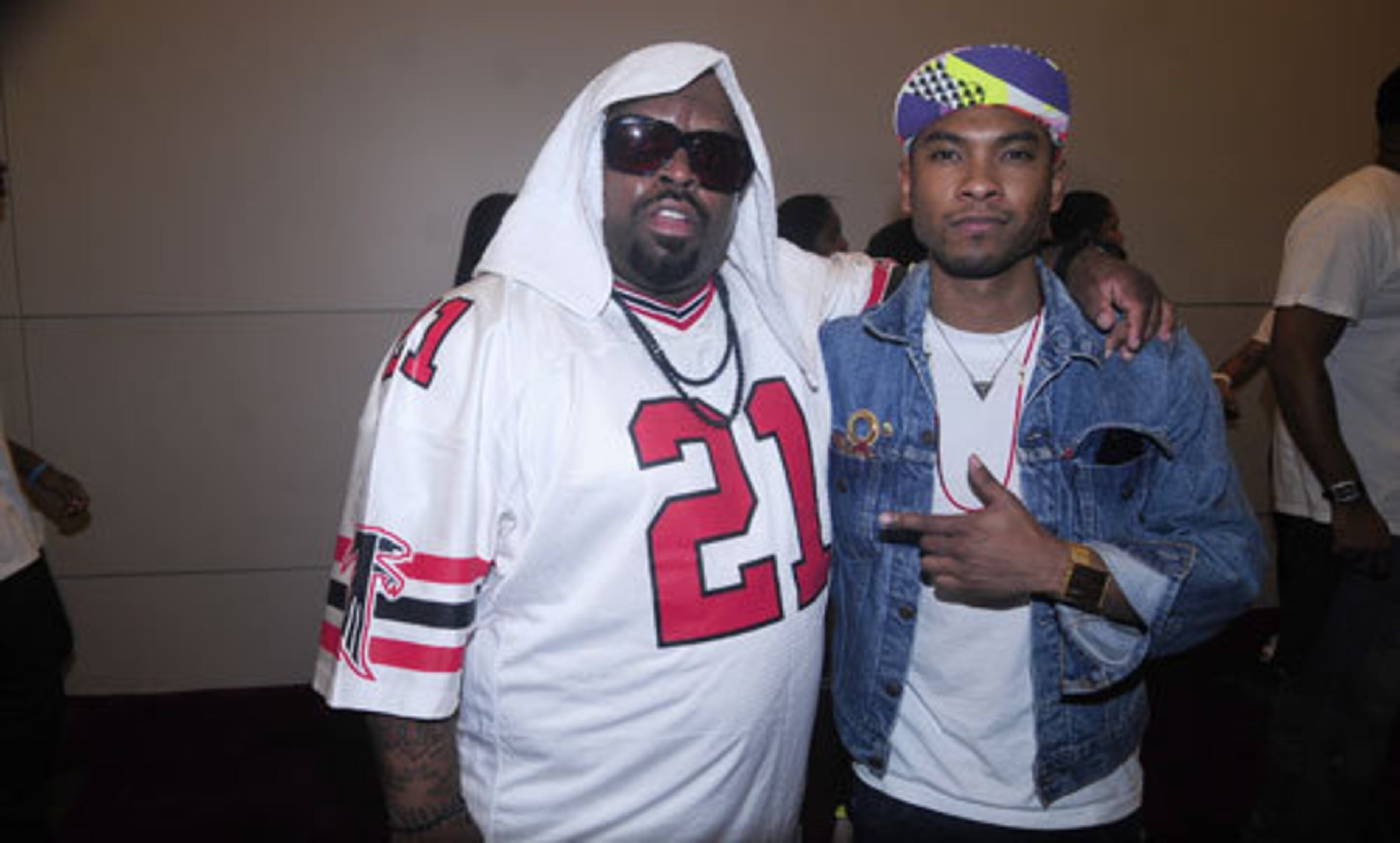 Cee Lo Green poses for a photo with Miguel backstage.