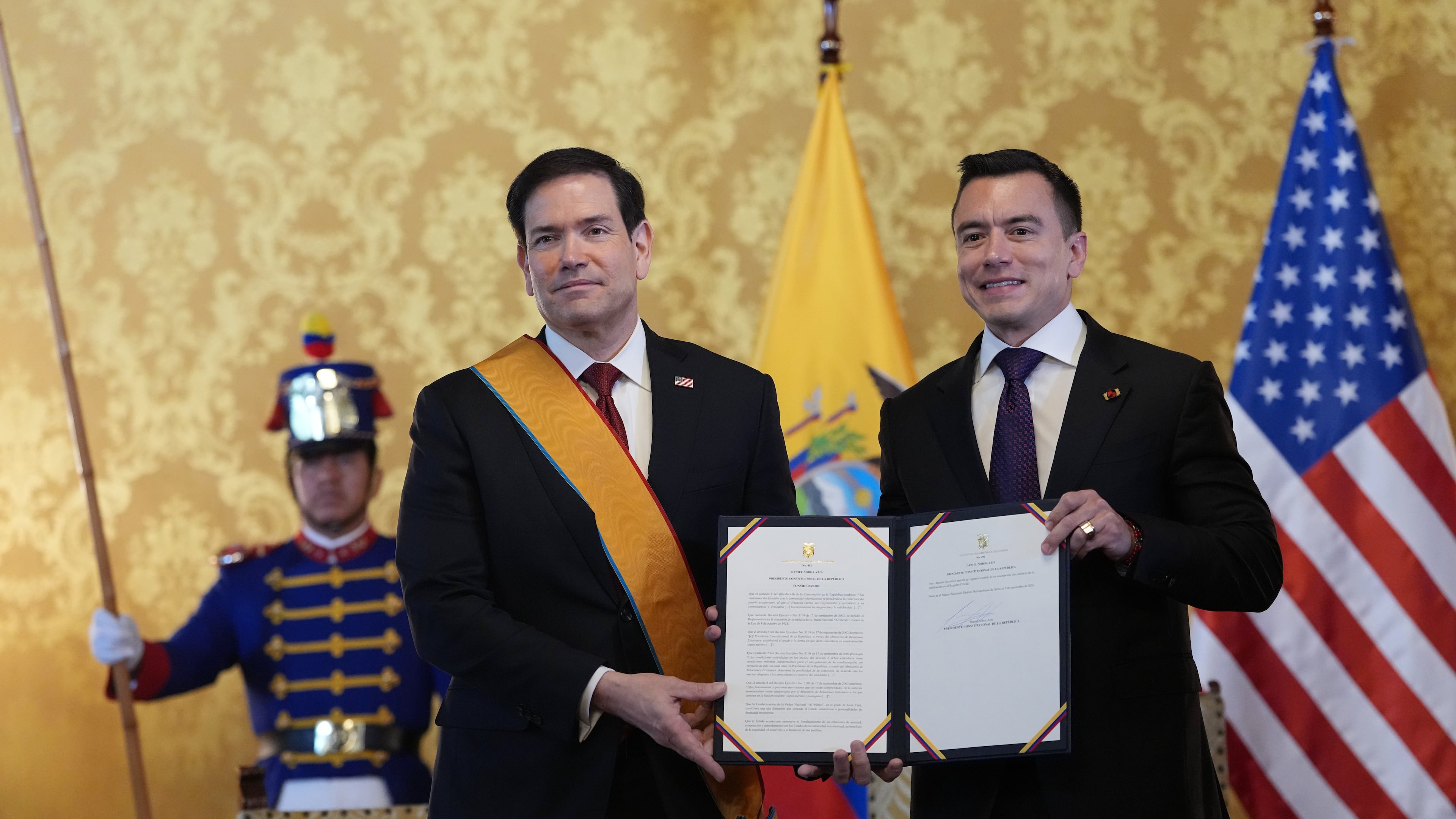 Ecuador's President Daniel Noboa, right, and U.S. Sec. of State Marco Rubio hold a document related to Ecuador's highest-ranking National Order of Merit, the Grand Cross, presented to Rubio, which he is wearing, at Carondelet palace in Quito, Ecuador, Wednesday, Sept. 9, 2026. (AP Photo/Dolores Ochoa, Pool)