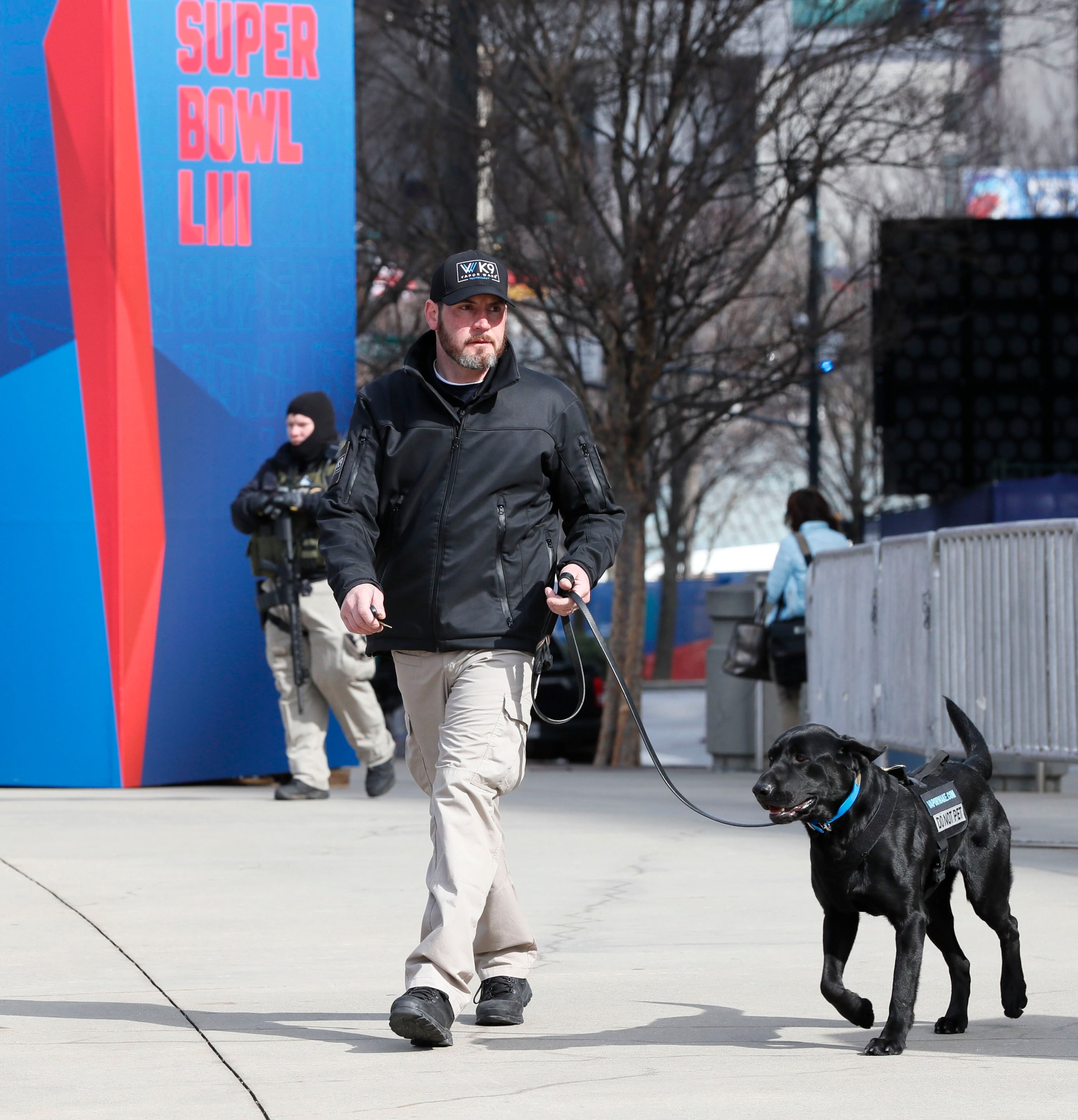 1/30/19 - Atlanta - Vapor Wake Weapons Detection Canines, trained for mass pedestrian weapons detection and explosives screening, are on hand to scan pedestrians at the entrance to the GWCC. Security around the Georgia World Congress Center and Mercedes-Benz Stadium includes multiple layers with personnel from multiple agencies Bob Andres / bandres@ajc.com