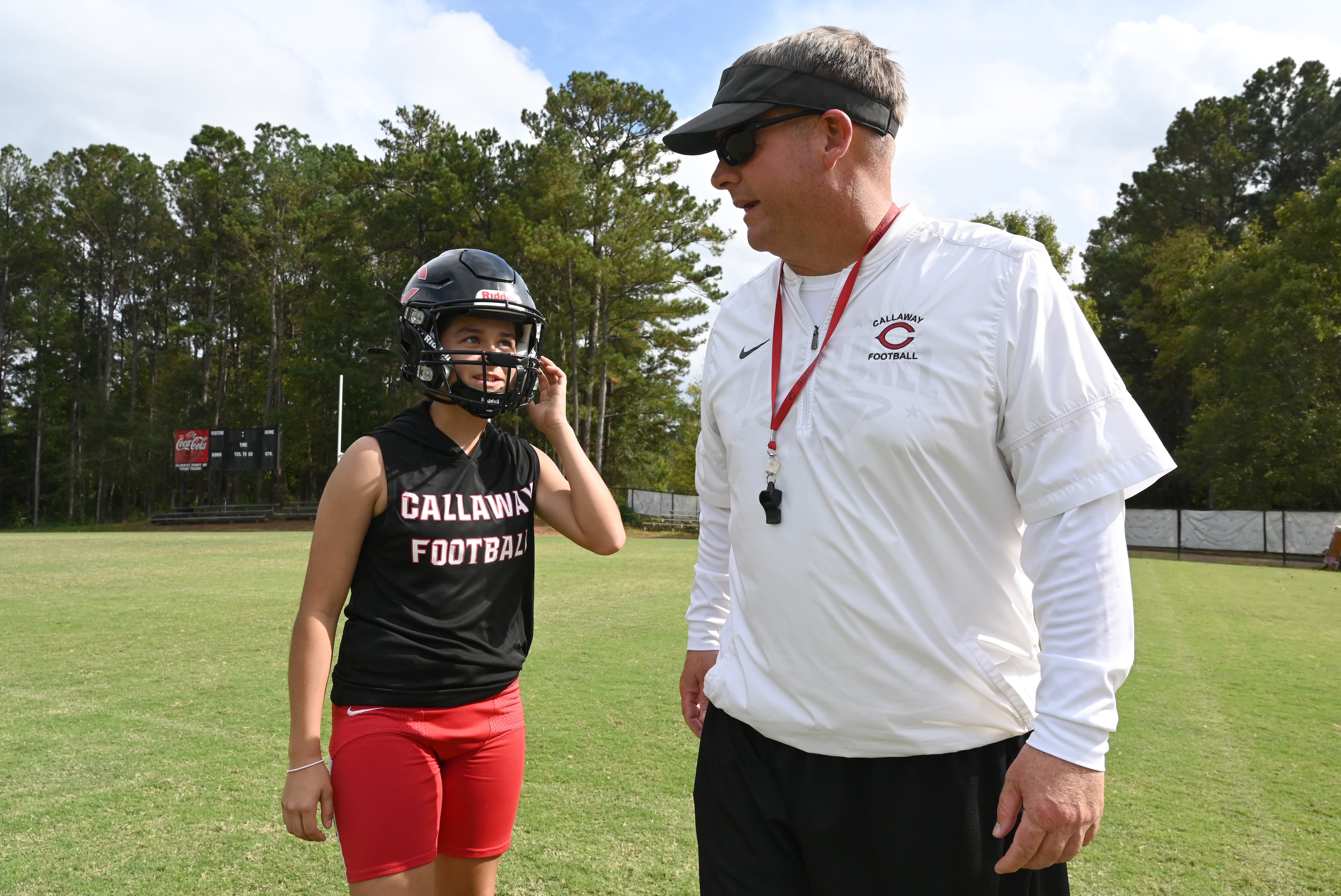 Callaway High’s head coach Pete Wiggins speaks to kicker Mia Flores during practice on Thursday, Sept. 25, 2025, in Hogansville. (Hyosub Shin/AJC)