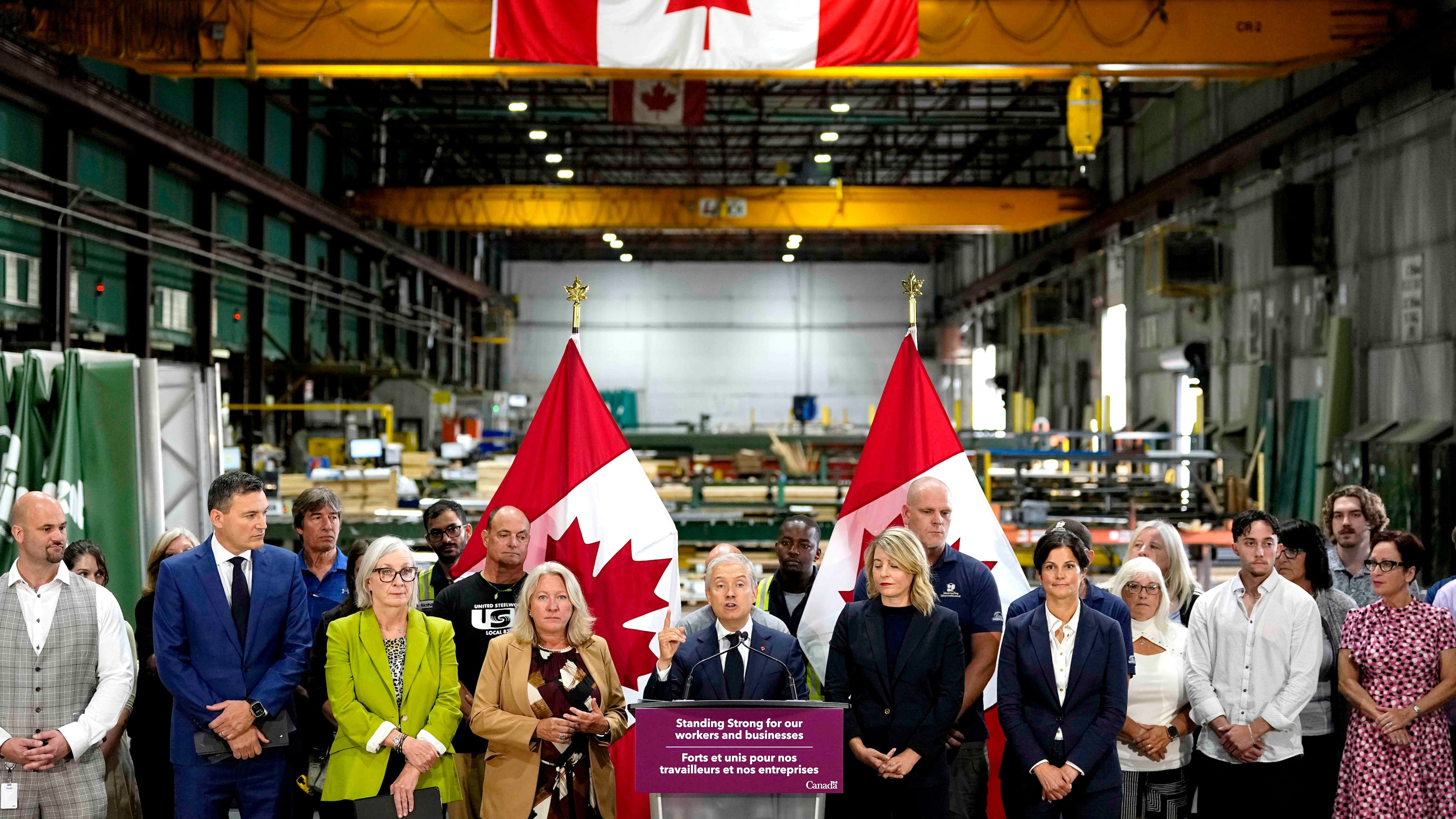 Minister of Finance and National Revenue Francois-Philippe Champagne speaks at a news conference on Canada's response to U.S. tariffs, at a roofing company in Ottawa, on Tuesday, Aug. 25, 2026. (Justin Tang/The Canadian Press via AP)
