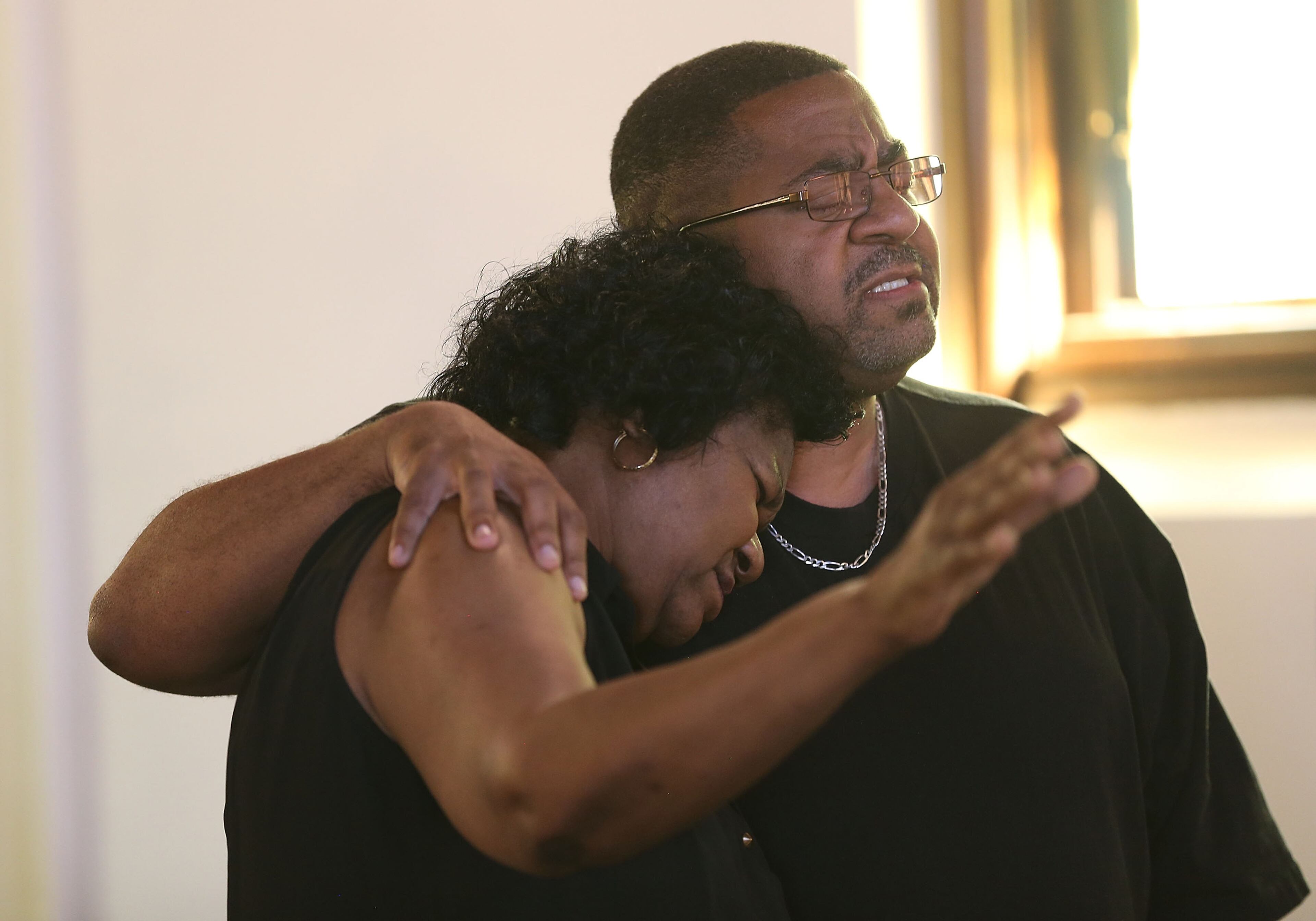CHATTANOOGA, TN - JULY 18: Barbara Woods (L) and Daryle Edmonds pray together during a memorial service at the Chattanooga Church to honor the four Marines and on Navy sailor killed during a shooting on July 18, 2015 in Chattanooga, Tennessee. According to reports, Mohammod Youssuf Abdulazeez, 24, opened fire on the military recruiting station at the strip mall on July 16th and then drove more than seven miles away to an operational support center operated by the U.S. Navy and killed four United States Marines and a Navy sailor. The gunman was likely killed in a exchange of gunfire with the police. (Photo by Joe Raedle/Getty Images)