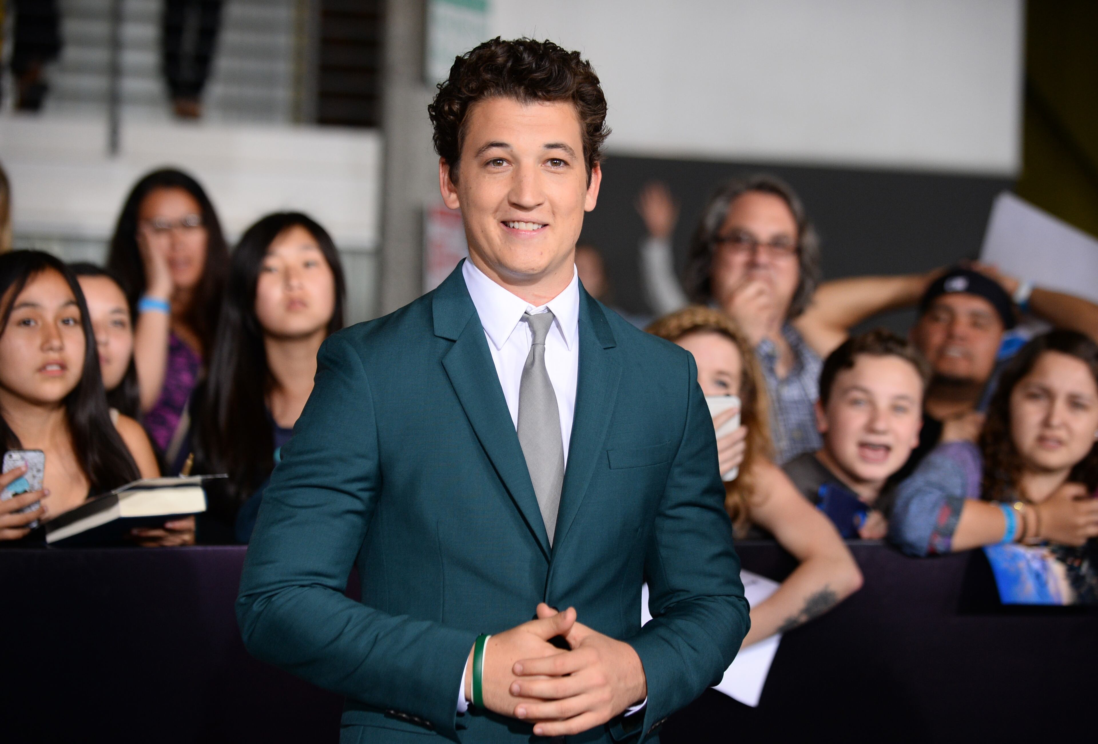 Miles Teller arrives at the world premiere of "Divergent" at the Westwood Regency Village Theater on Tuesday, March 18, 2014, in Los Angeles. (Photo by Jordan Strauss/Invision/AP)