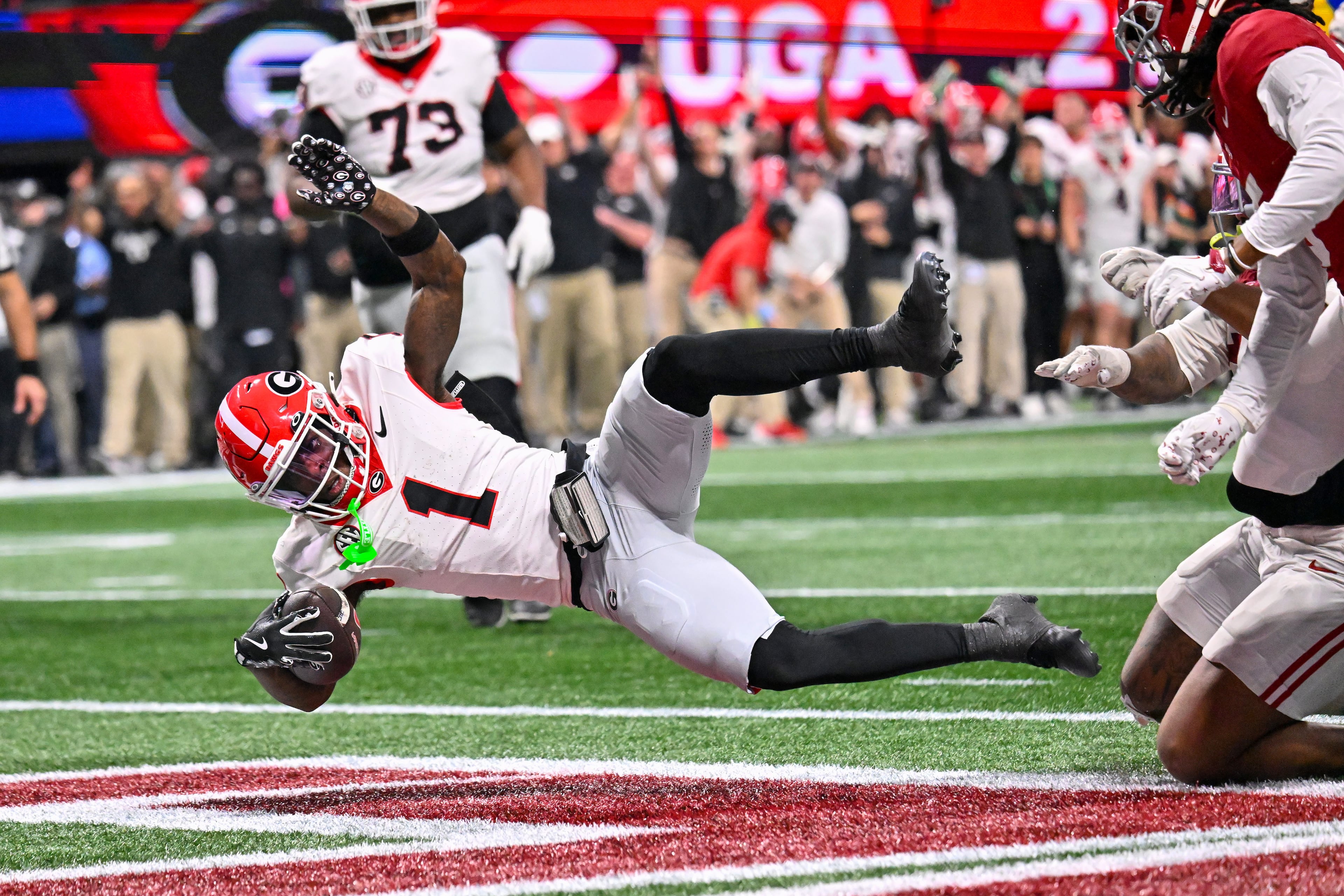 Georgia wide receiver Zachariah Branch (1) runs for a 13-yard touchdown against Alabama during the fourth quarter of the SEC Championship game at Mercedes-Benz Stadium, Saturday, Dec. 6, 2025, in Atlanta. (Hyosub Shin / AJC)