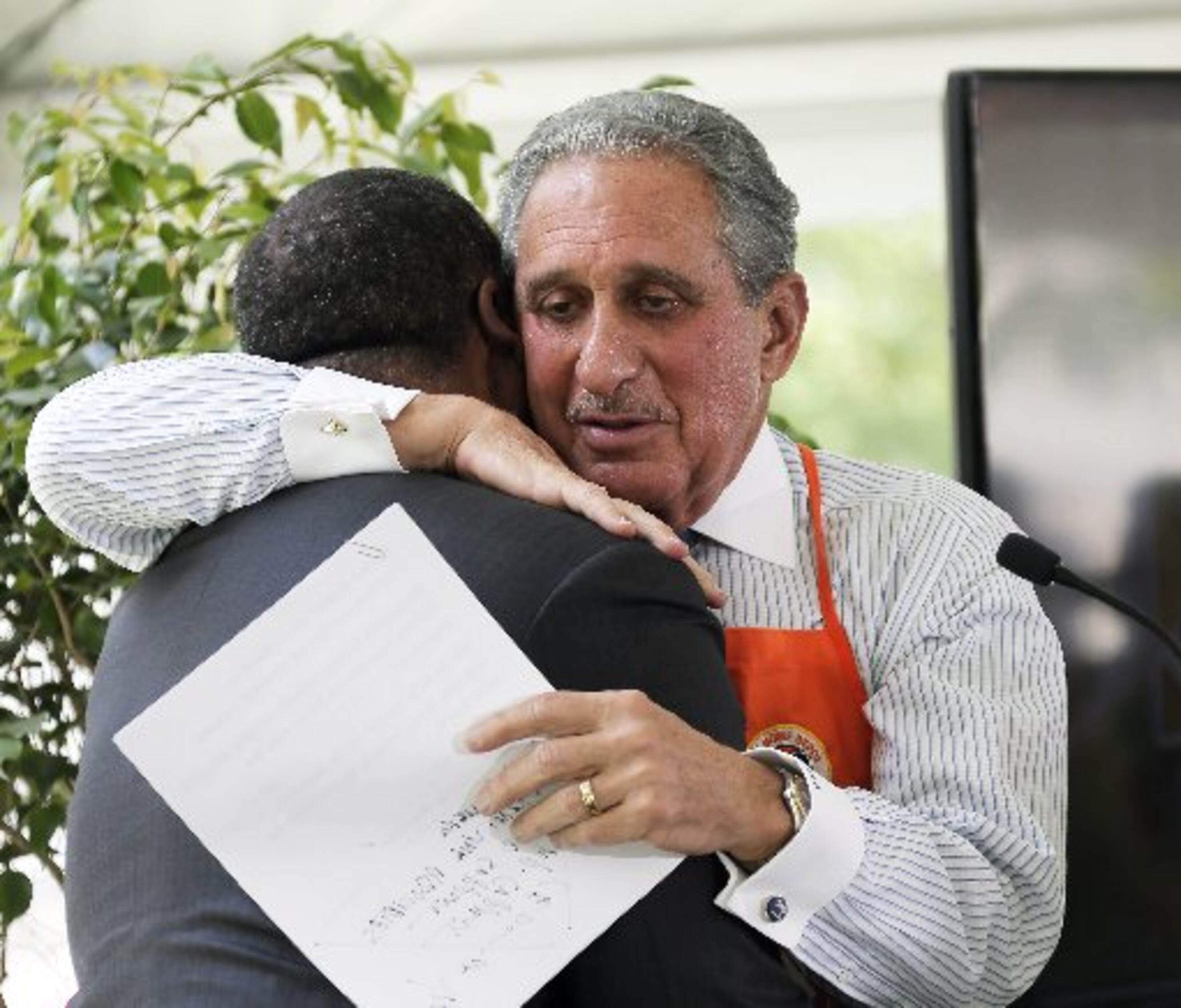 Atlanta Falcons owner Arthur Blank hugs Kasim Reed after the Atlanta mayor gave him a warm introduction at the Friday press conference announcing Home Depot Backyard.