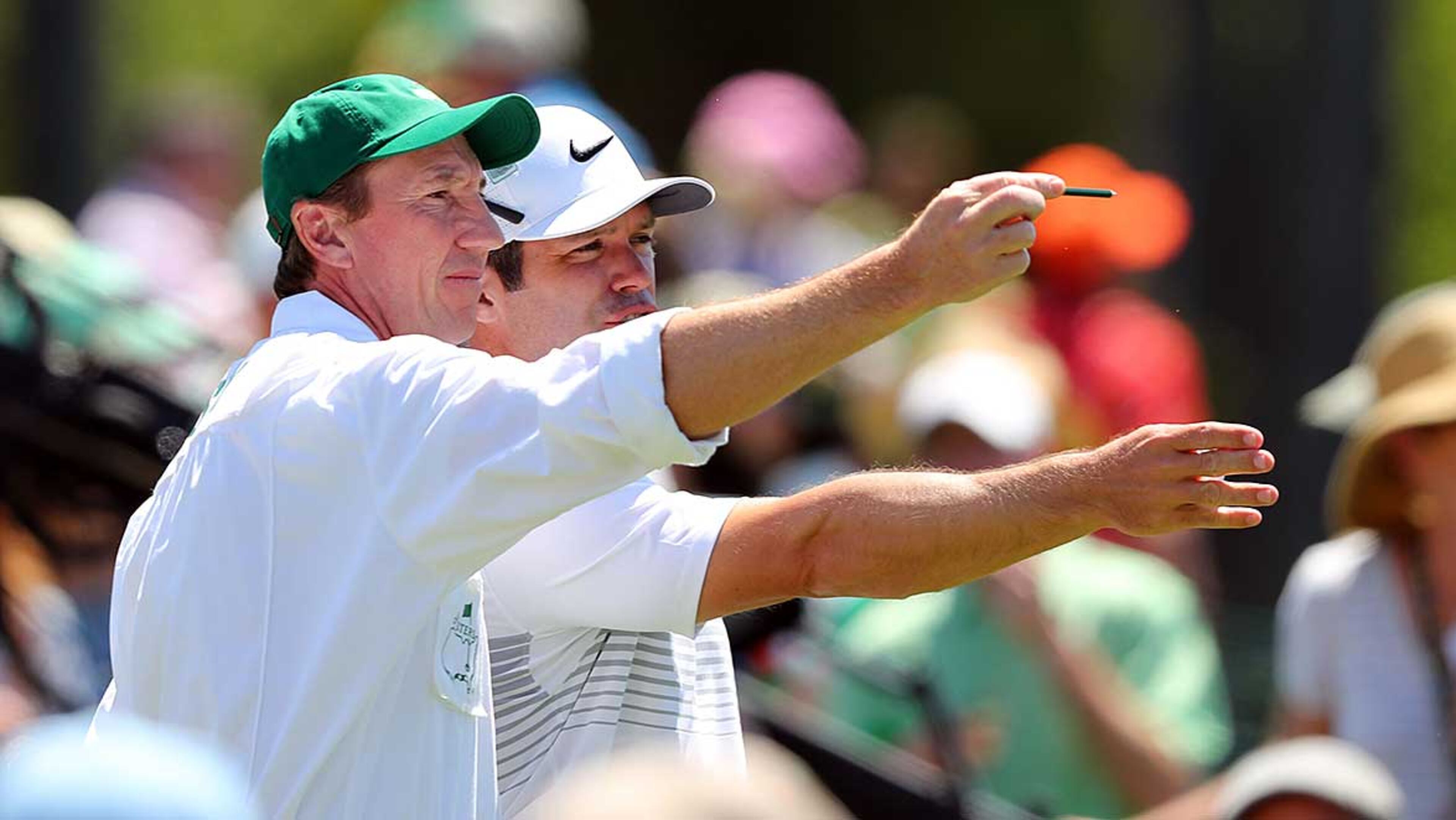 Paul Casey and his caddie John McLaren check conditions from the 1st tee during the final round of the Masters Sunday in Augusta.