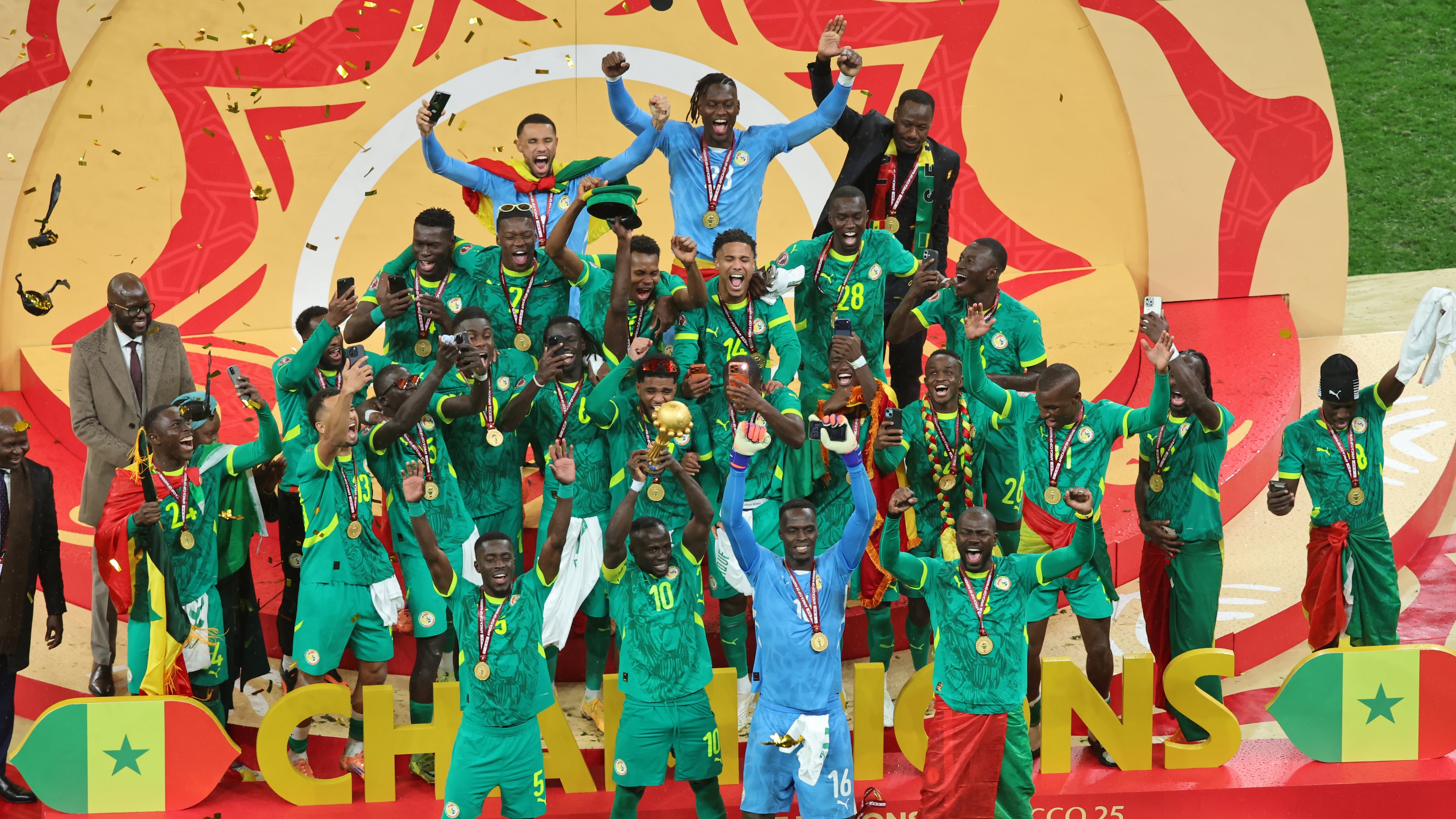 Senegal's Sadio Mane holds the trophy aloft as he celebrates with teammates after winning the Africa Cup of Nations final soccer match between Senegal and Morocco in Rabat, Morocco, Sunday, Jan. 18, 2026. (AP Photo/Youssef Loulidi)