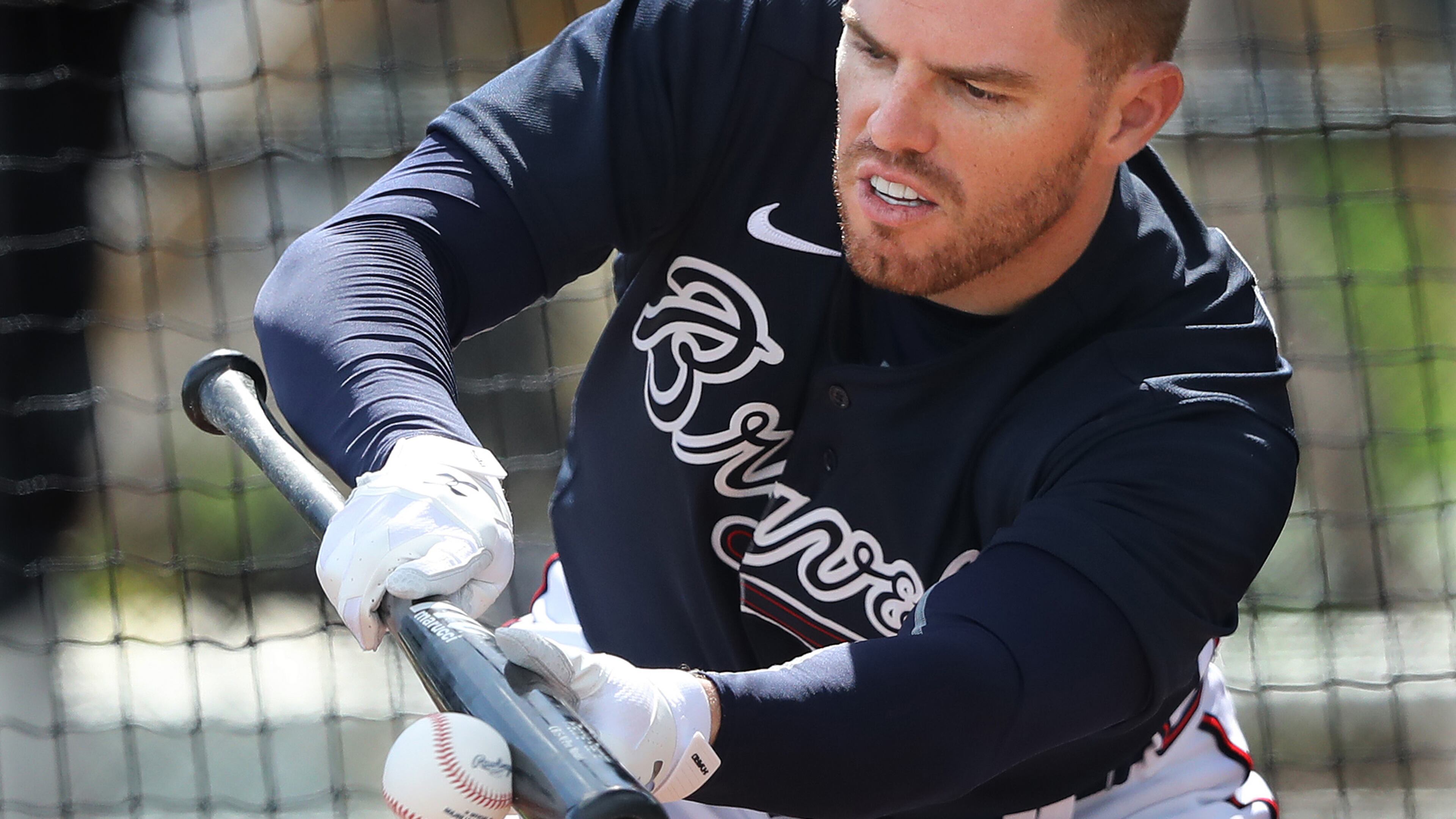 Braves first baseman Freddie Freeman connects with the ball to lay down a bunt during the first full squad workout Tuesday, Feb. 18, 2020, at CoolToday Park in North Port, Fla.