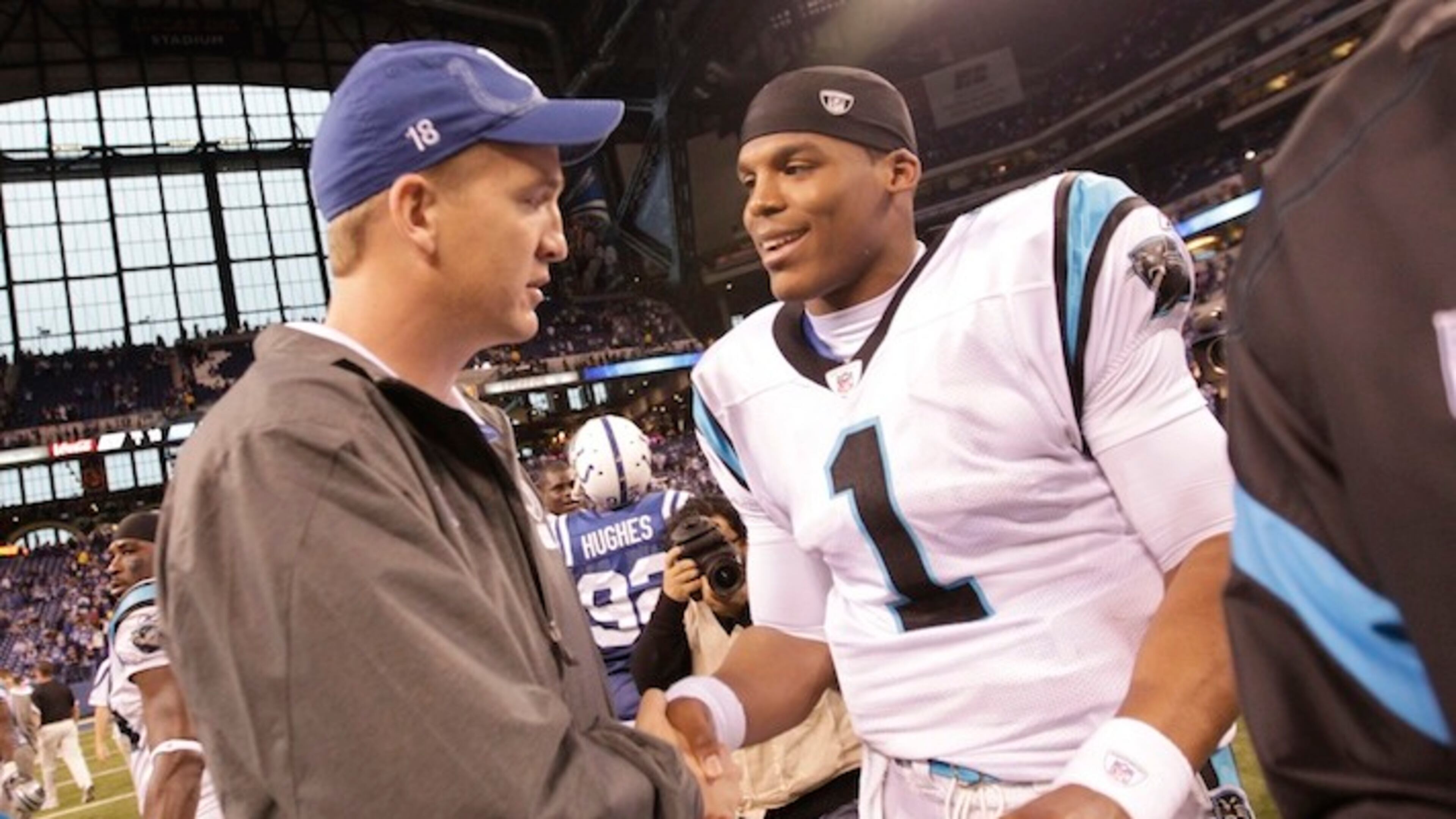 FILE - In this Nov. 27, 2011, file photo, injured Indianapolis Colts quarterback Peyton Manning meets with Carolina Panthers quarterback Cam Newton after an NFL football game in Indianapolis. For the next two weeks, until Peyton Manning's AFC champion Denver Broncos face Cam Newton's NFC champion Carolina Panthers in the 50th Super Bowl in Santa Clara, California, most of the focus will be on the two quarterbacks who were No. 1 overall draft picks 13 years apart. (AP Photo/AJ Mast, File)