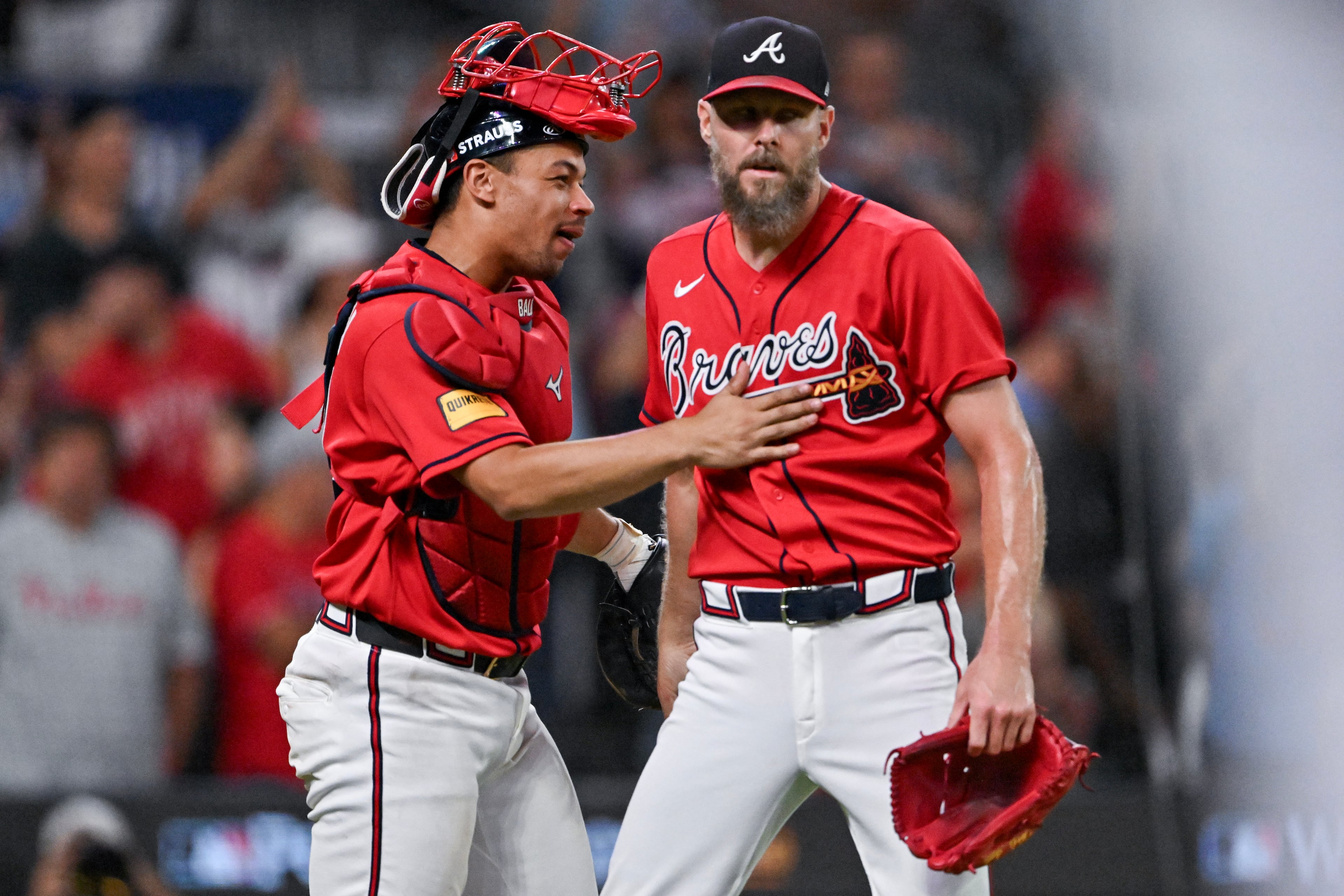 Atlanta Braves catcher Drake Baldwin (left) celebrates with Chris Sale after his maniacal relief appearance to close out the Phillies. (Hyosub Shin/AJC)