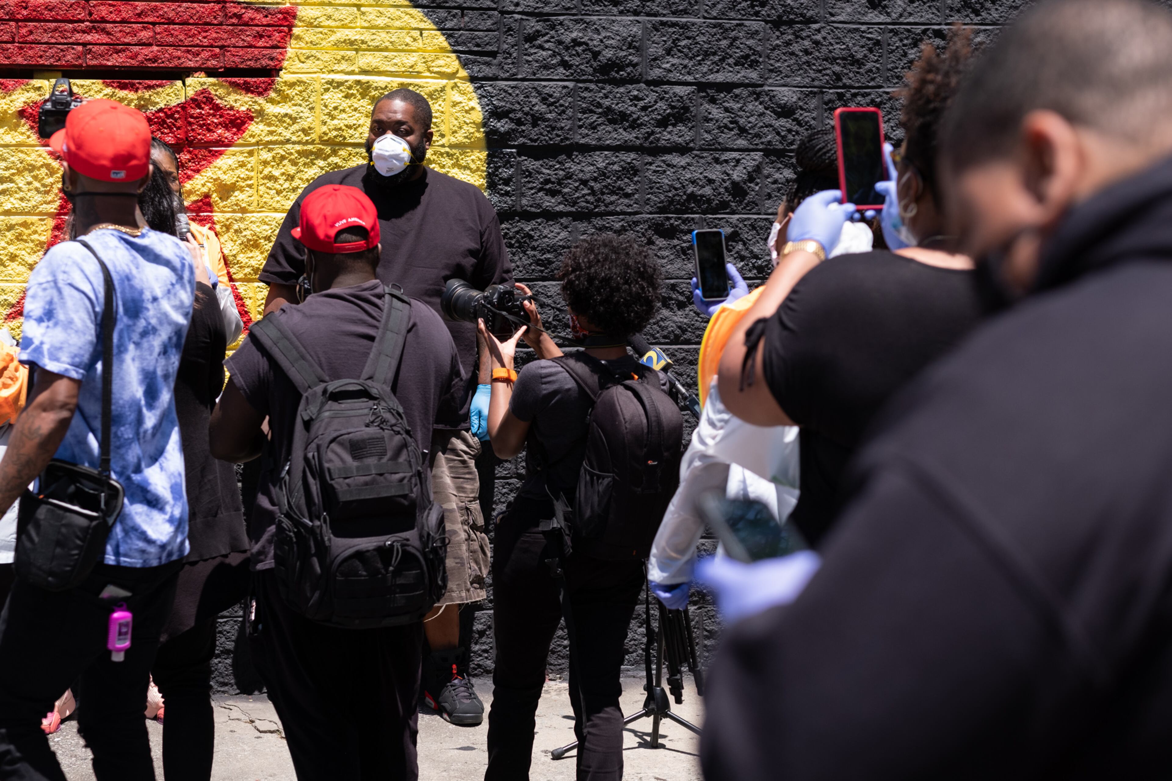 200506-Atlanta- Niya Woods reacts as T.I. walks up her driveway to surprise her with hygiene supplies and $500 Wednesday afternoon May 6, 2020. T.I. and Killer Mike made the surprise deliveries and shared the news that two-weeks of groceries were on the way to five families served by PAWkids, a childrenâs enrichment program. Ben@BenGray.com for the Atlanta Journal Constitution