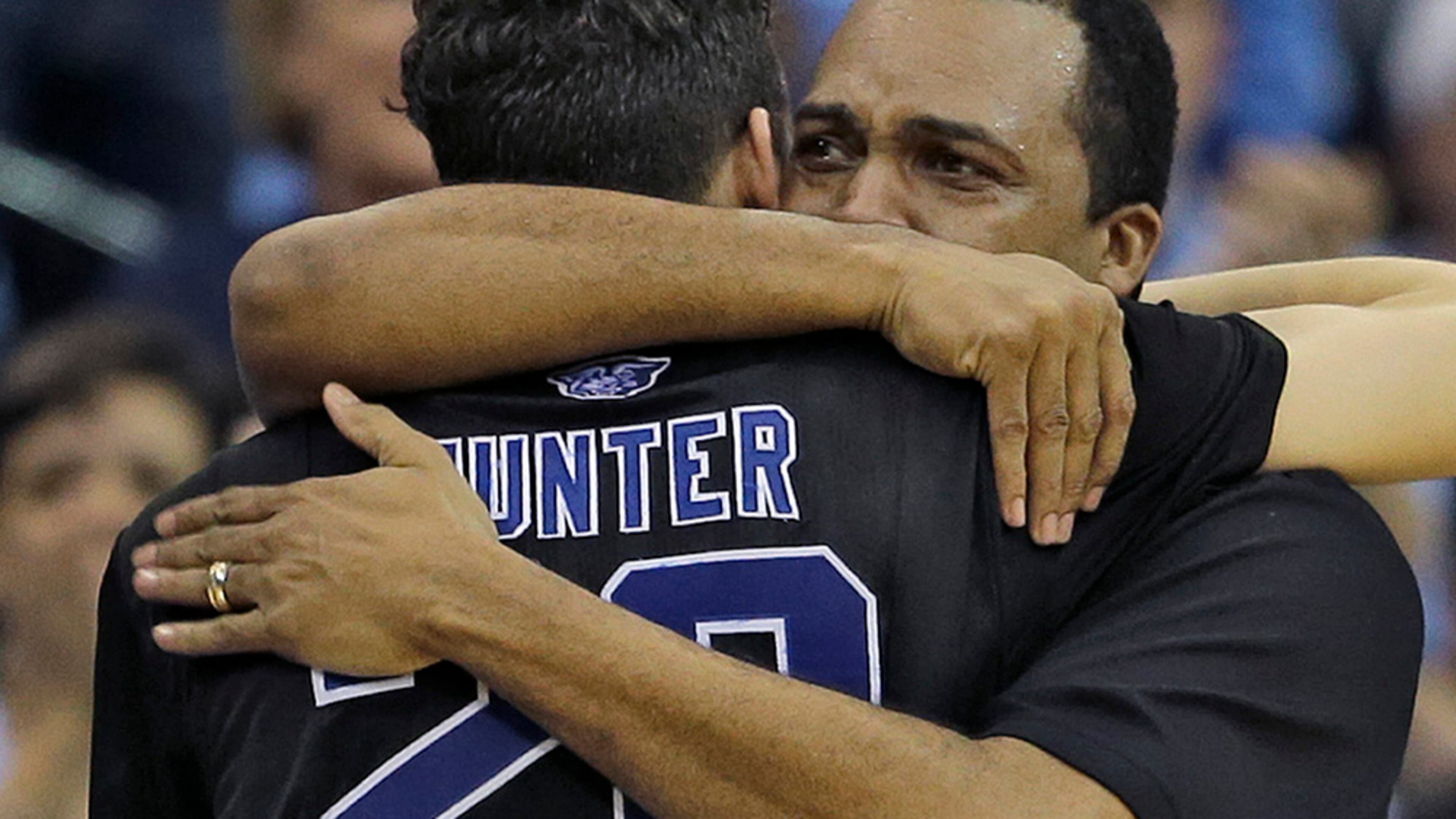 Georgia State head coach Ron Hunter hugs his son R.J. after taking him out of the game against Xavier during the second half of an NCAA tournament third round basketball game Saturday, March 21, 2015, in Jacksonville, Fla. Xavier defeated Georgia State 75-67. (AP Photo/Chris O'Meara)