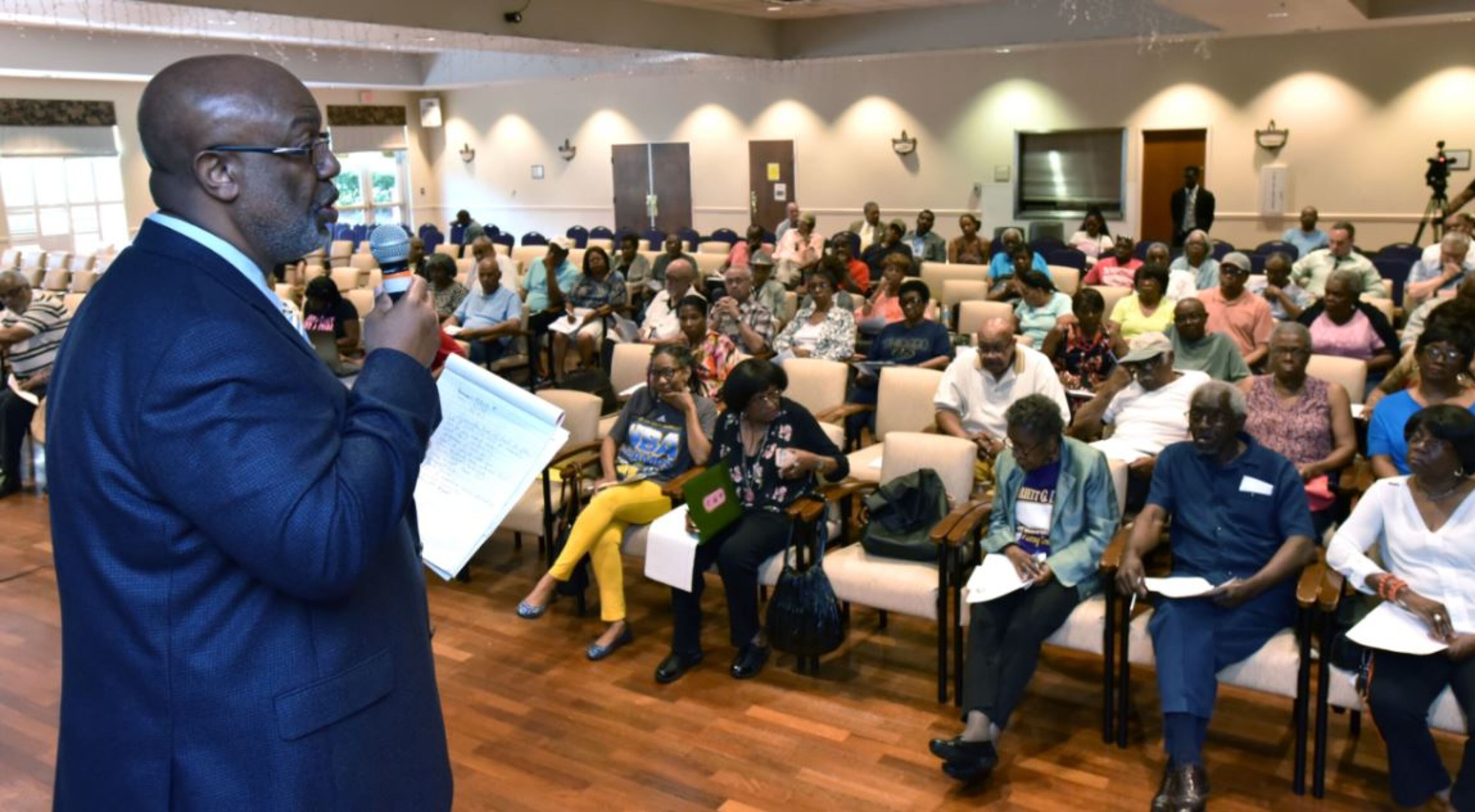 Dwight Robinson, chef appraiser, speaks before Fulton County residents during Wednesday town hall meeting in advance of Thursday’s meeting of the county’s Board of Assesssors to determine if they will uphold the current property assessments, which feature dramatic increases over last year. HYOSUB SHIN / HSHIN@AJC.COM