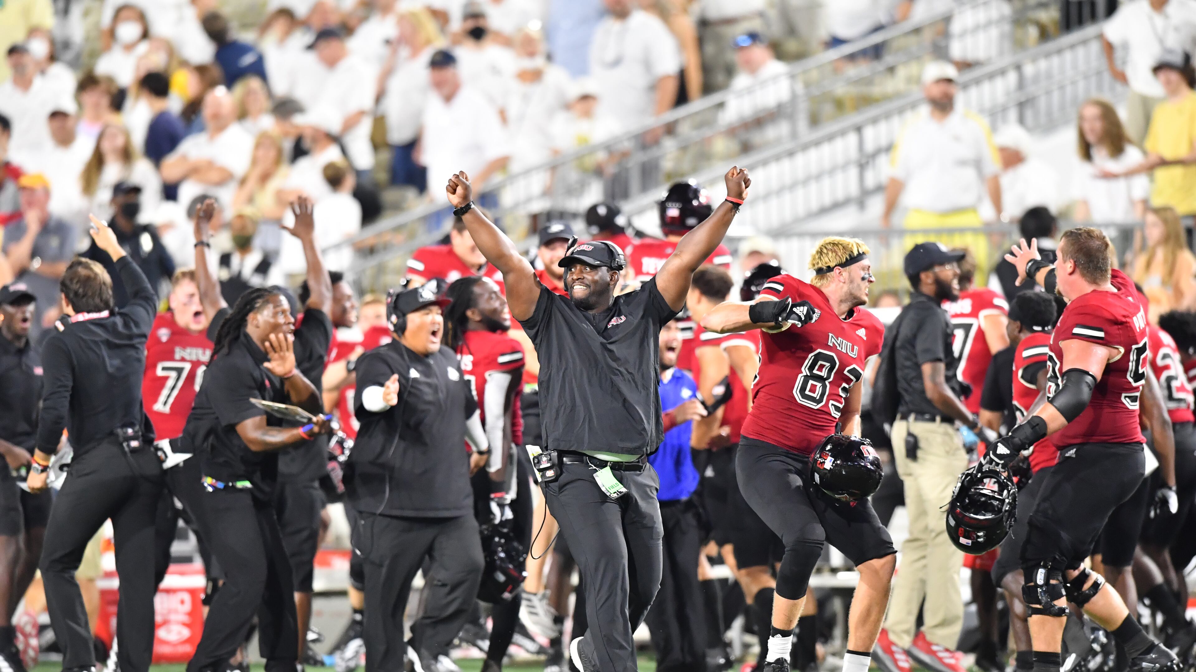 Northern Illinois players and coaching staff celebrate after Northern Illinois wide receiver Tyrice Richie (3) made the game-winning catch during the second half Saturday, Sept. 4, 2021, at Bobby Dodd Stadium in Atlanta. (Hyosub Shin / Hyosub.Shin@ajc.com)