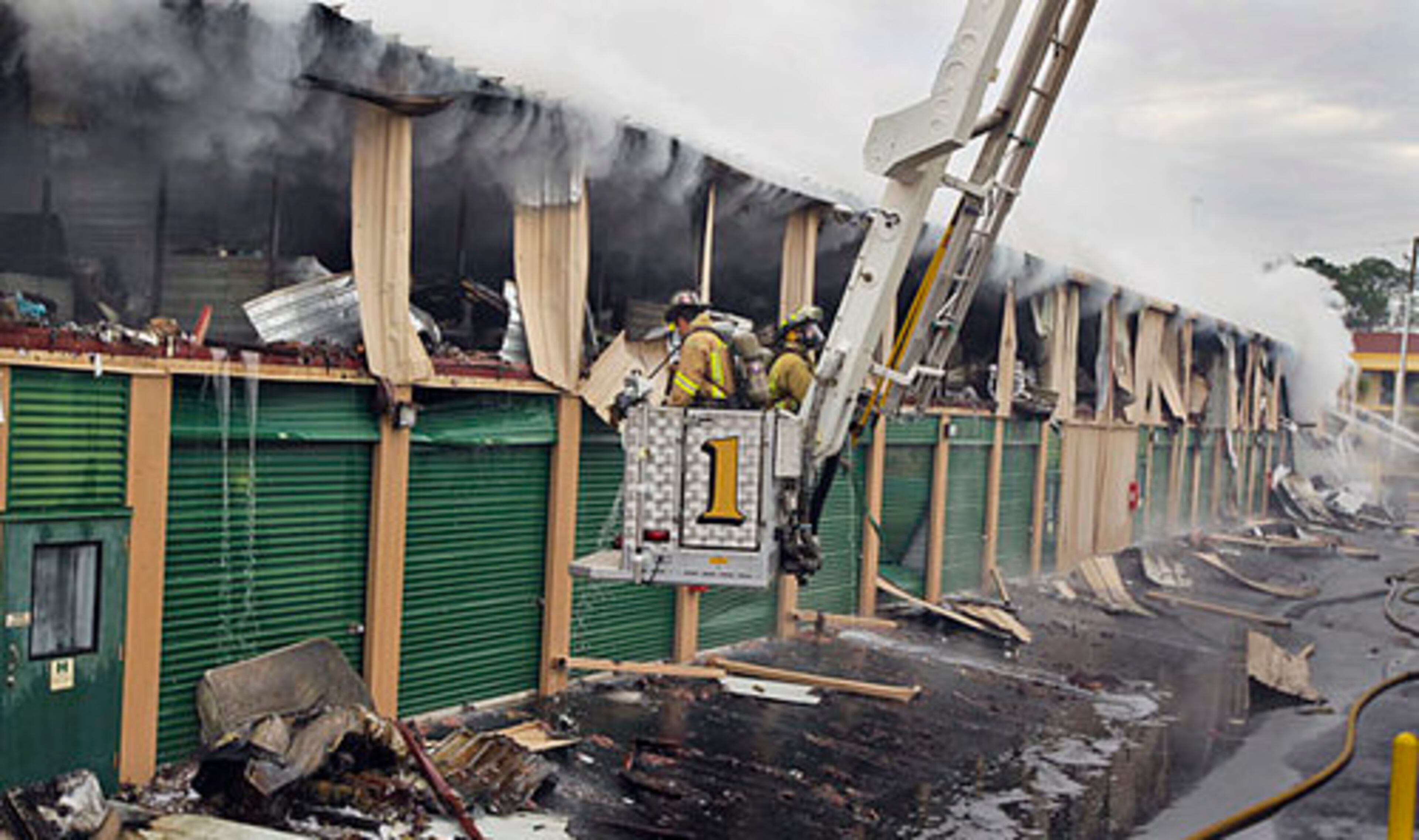 Firefighters continue to pour water on hotspots Friday.