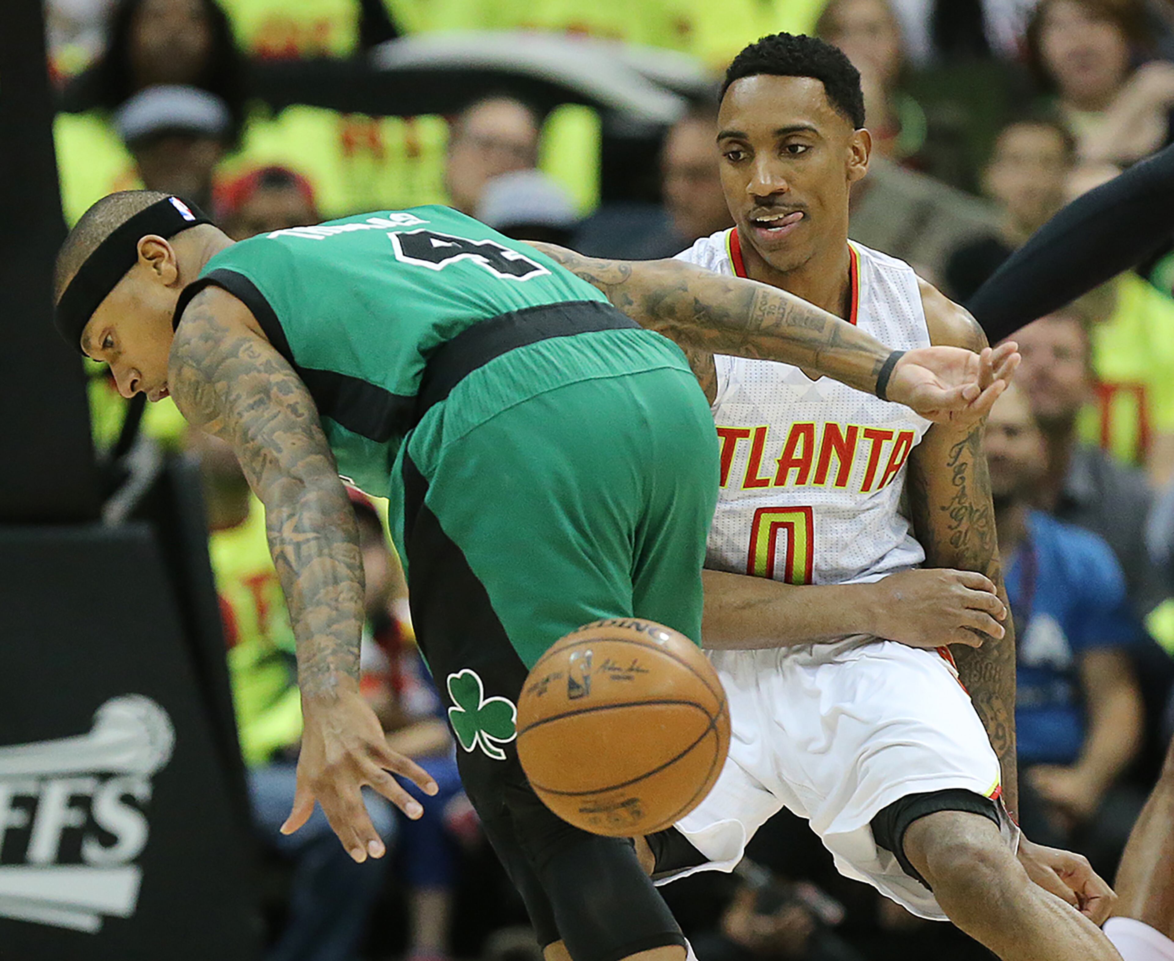 041616 ATLANTA: Hawks guard Jeff Teague strips the ball from Celtics guard Isaiah Thomas in their NBA Eastern Conference first round playoff game at Philips Arena on Saturday, April 16, 2016. Curtis Compton / ccompton@ajc.com