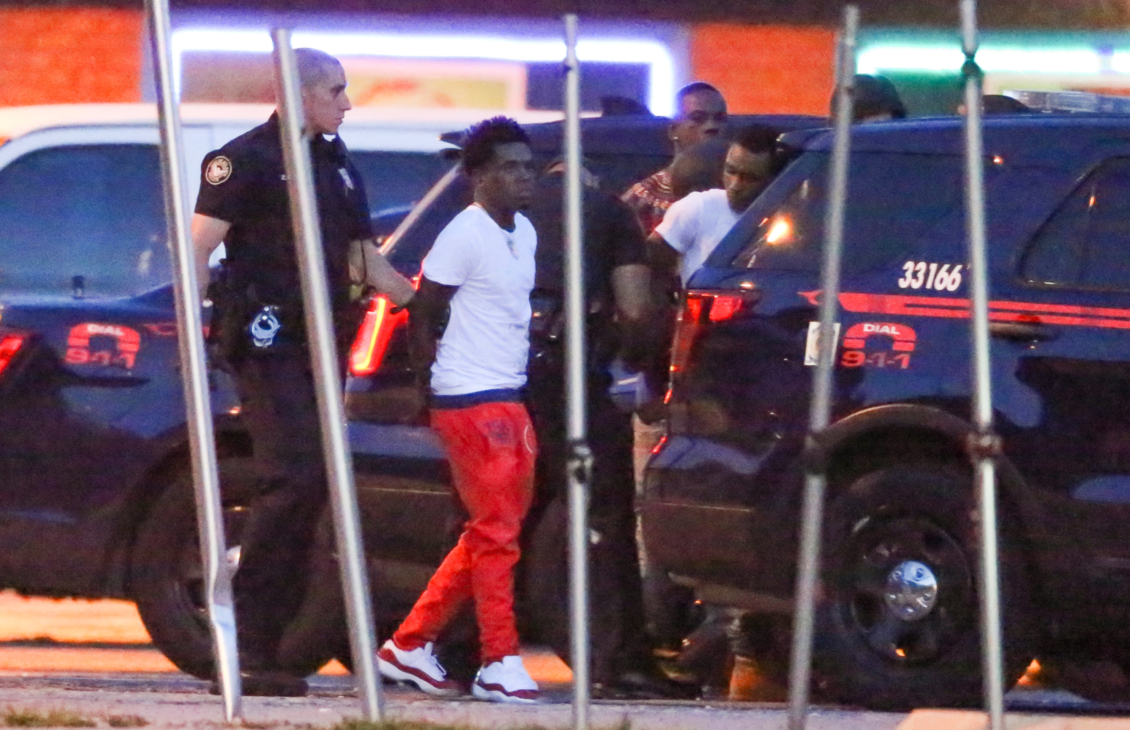 SWAT ARRESTS-- June 6, 2016 Atlanta: Eight people were arrested early Monday, June 6. 2016 after an hours-long SWAT situation at a northwest Atlanta barbershop, police said. About 6:30 a.m., five people came out of Crazy Cutz barbershop with their hands above their heads, hours after police arrested two adults and one teen and recovered two rifles. One of the rifles is believed to be stolen, police said. Officers were called to the business on Hollowell Parkway about 1 a.m. "People saw children out there with weapons," Atlanta police Capt. John Quigley said. When police arrived, a group of teens and adults started running. Officers were able to catch the two adults and one teenager, Quigley said. The suspects are 16, 19 and 20 years old. Believing some people ran inside the barbershop, SWAT surrounded the building and prepared to enter. That's when the group exited the business with their hands behind their heads. It's unclear how the suspects got inside the building. After arresting the eight people, officers used tear gas to drive out anyone who may have still been in the building. Police waited for the gas to dissipate, so officers could do a more thorough search of the building, police said. Quigley said officers were unable to reach the business owner to get inside initially and instead had to get a warrant. JOHN SPINK /JSPINK@AJC.COM