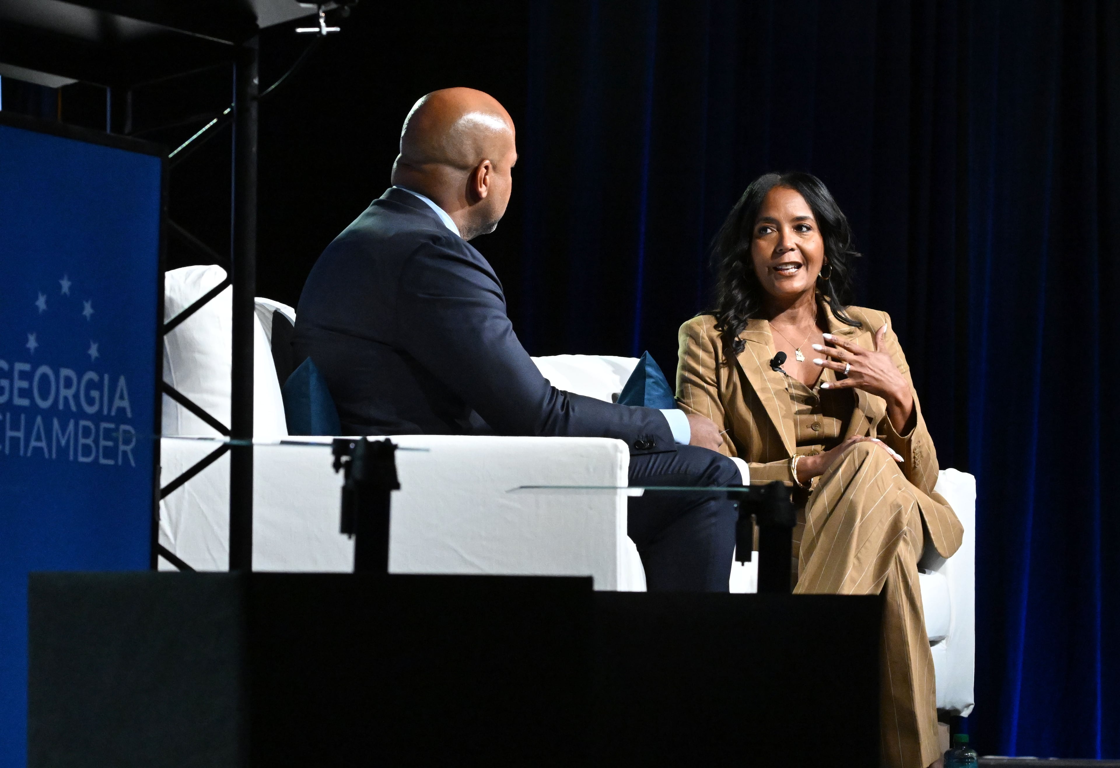 Gubernatorial candidate Keisha Lance Bottoms (right) speaks with moderator Tharon Johnson during the Georgia Chamber congressional luncheon Wednesday, Aug. 5, 2026, at the Classic Center in Athens. (Hyosub Shin/AJC)