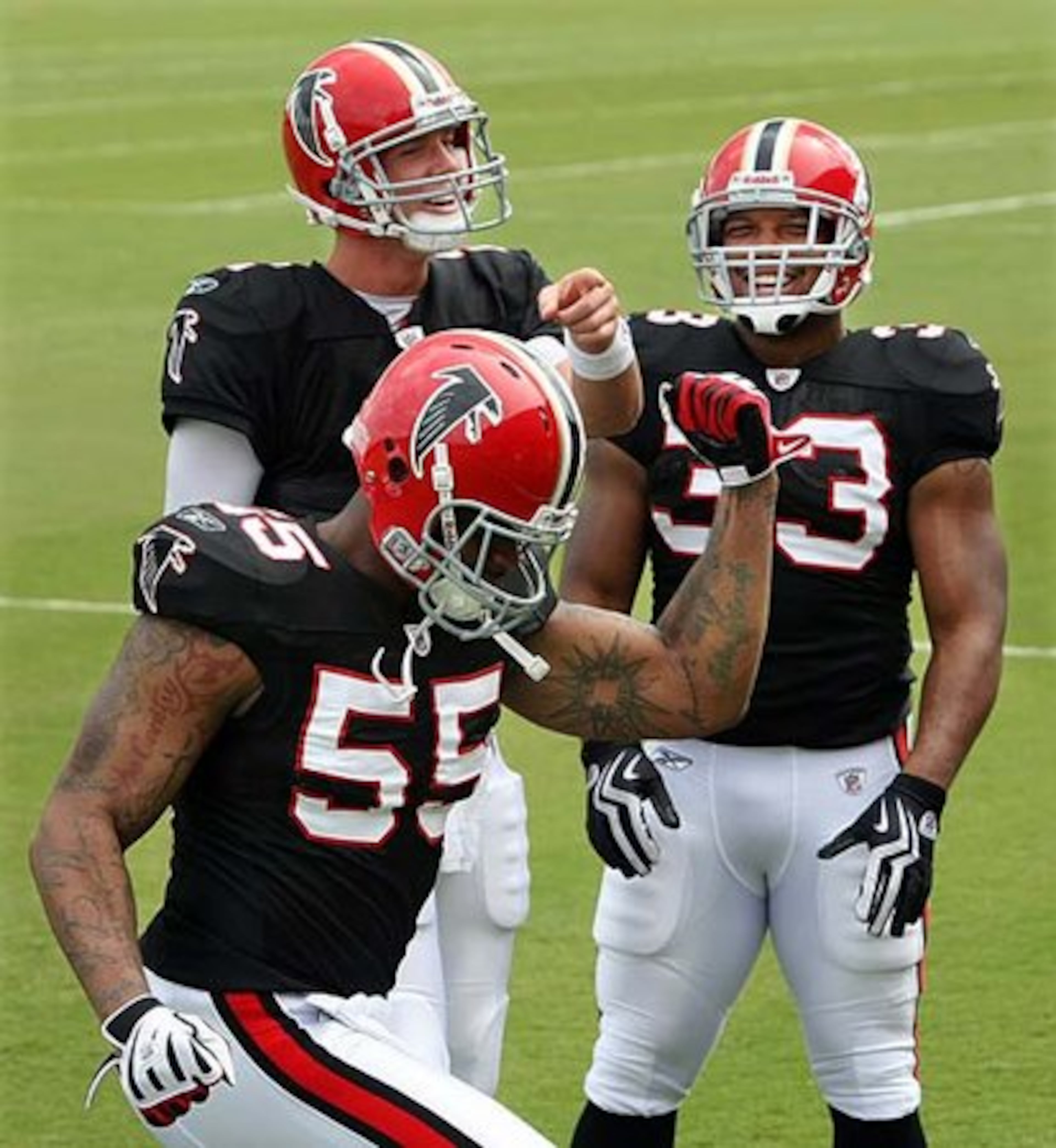 WHICH WAY TO THE RUNWAY? John Abraham (55) strikes a pose for the camera as Matt Ryan (center) and Michael Turner (33) look on.