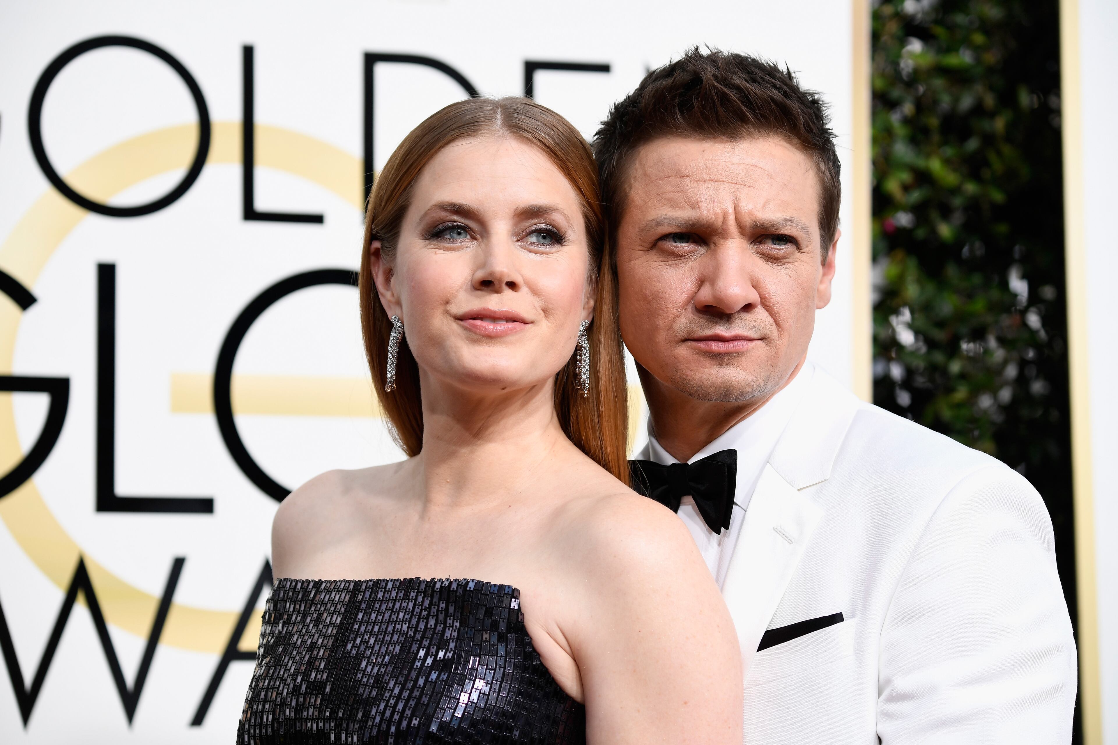 BEVERLY HILLS, CA - JANUARY 08: Amy Adams (L) and Jeremy Renner attend the 74th Annual Golden Globe Awards at The Beverly Hilton Hotel on January 8, 2017 in Beverly Hills, California. (Photo by Frazer Harrison/Getty Images)