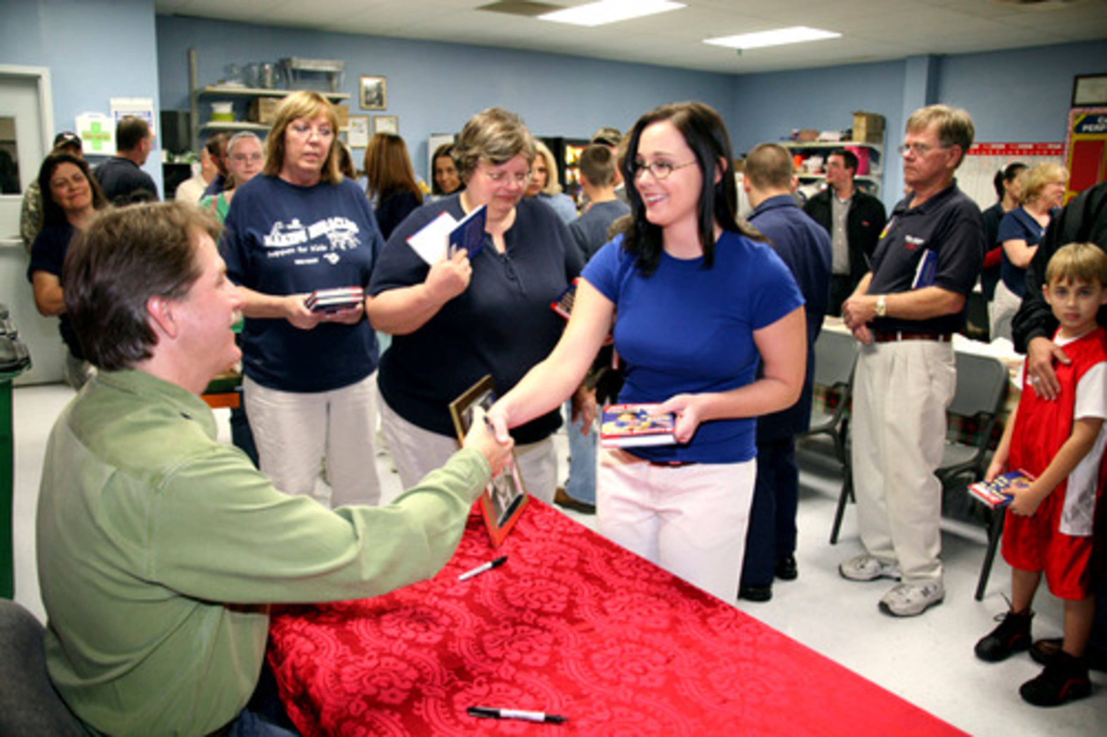 Julie Aycox of Loganville gets to meet Jeff Foxworthy. He graciously signed books and autographs for dozens of Wal-Mart employees.