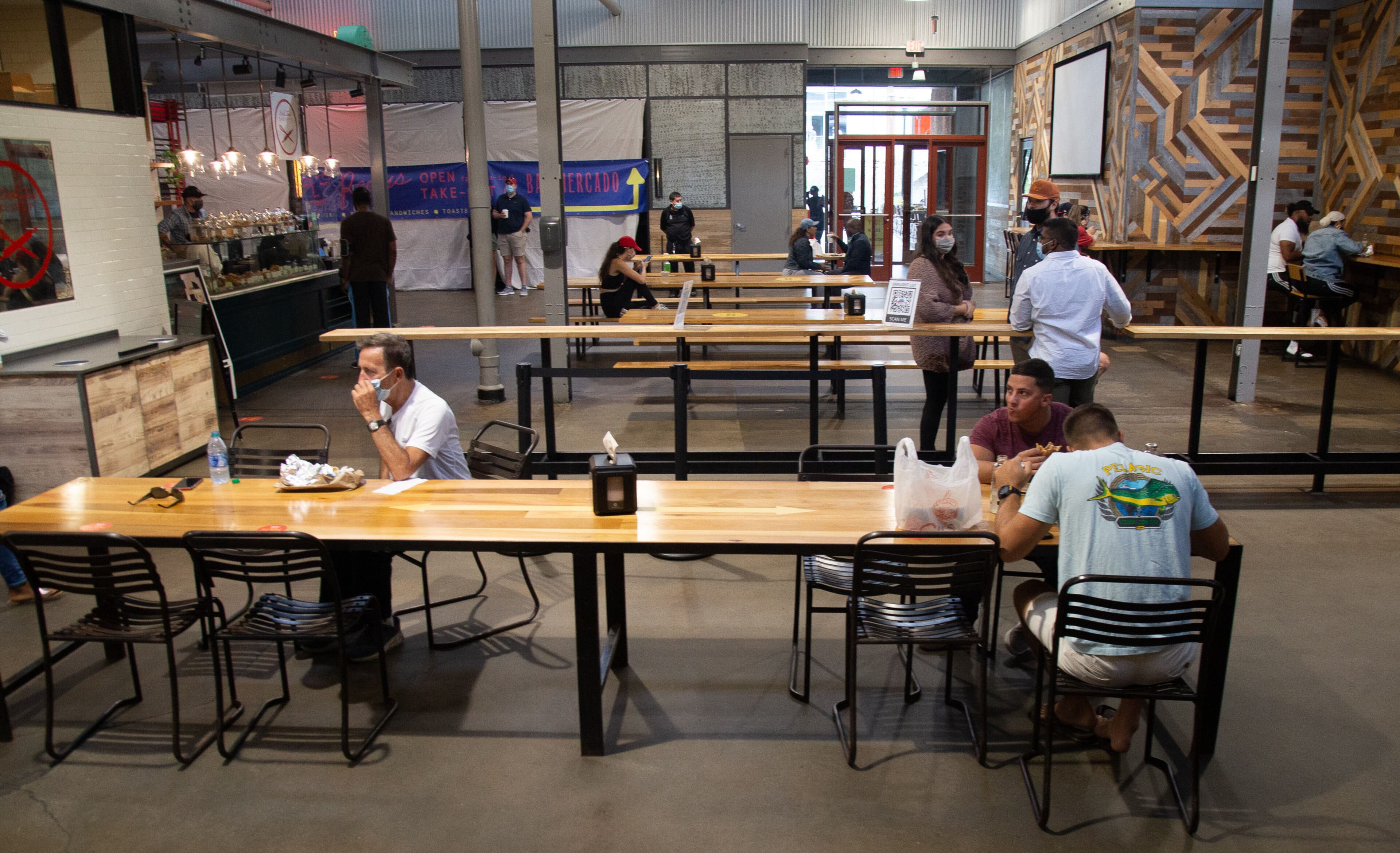 People sit in the Krog Street Market's food hall on Saturday, September 26, 2020. STEVE SCHAEFER / SPECIAL TO THE AJC