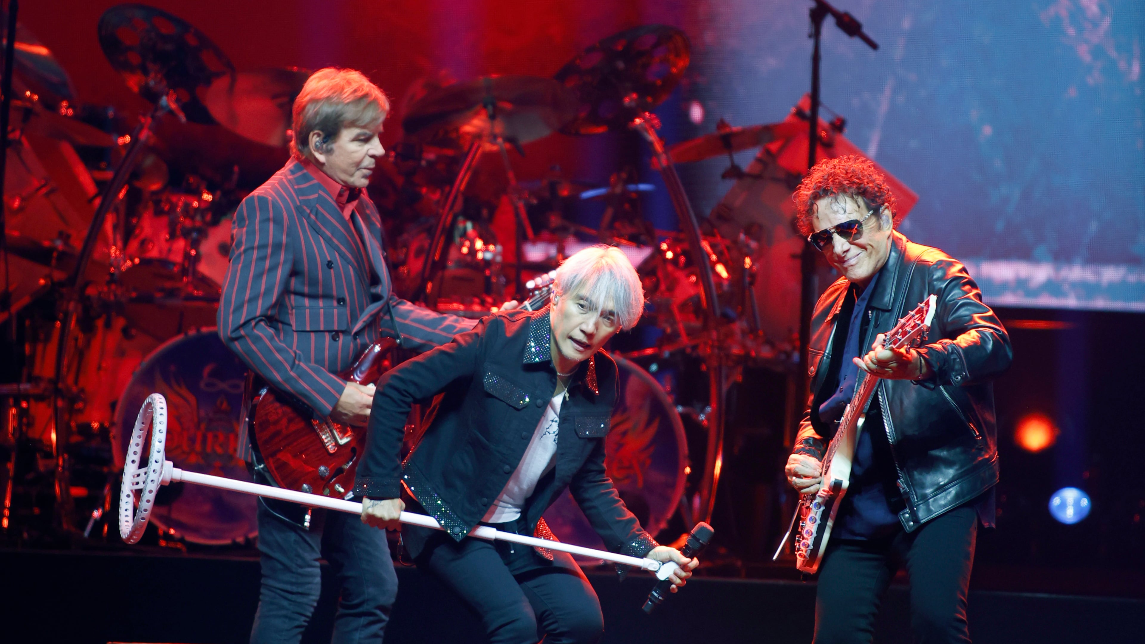 Journey frontmen (from left) guitarist Jonathan Cain, lead vocalist Arnel Pineda and and founding member/lead guitarist Neal Schon perform at the State Farm Arena in Atlanta, Monday, Oct. 19, 2026. (Akili-Casundria Ramsess for the AJC)