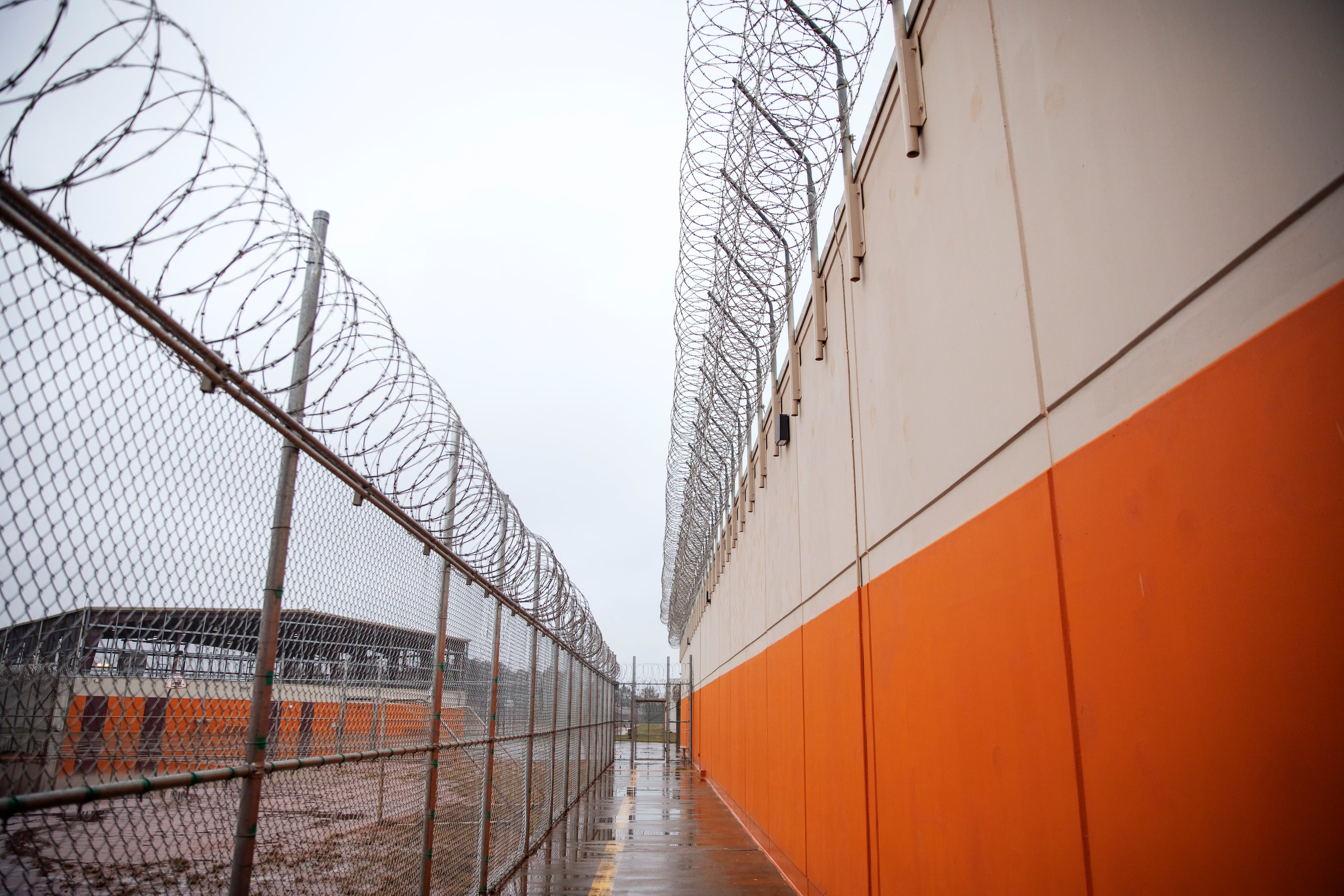 Barbed wire lines a recreation area at the Stewart Detention Center in Lumpkin, Ga. Judges have been denying bond to detained immigrants at high rates since Donald Trump reclaimed the White House. (David Goldman/AP 2019)