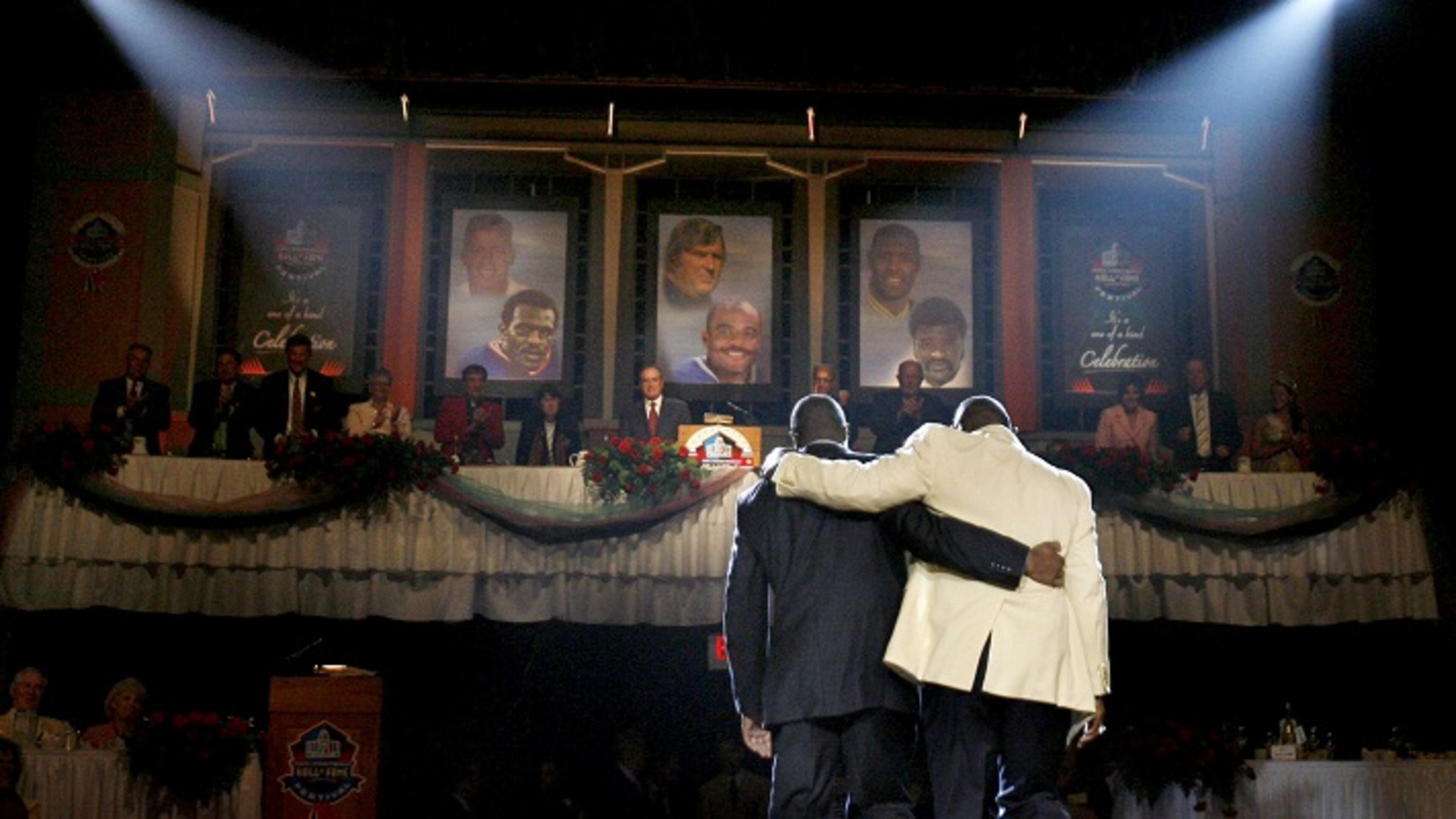 After receiving his blazer from his son Donald Carson, New York Giants' Harry Carson walks arm-in-arm with his son off stage during ceremonies at the Enshrinement Dinner in Canton, Ohio on Friday, August 4, 2006. (Louis DeLuca/Dallas Morning News/TNS)NO MAGAZINE SALES MANDATORY CREDIT; NO SALES; INTERNET USE BY TNS CONTRIBUTORS ONLY