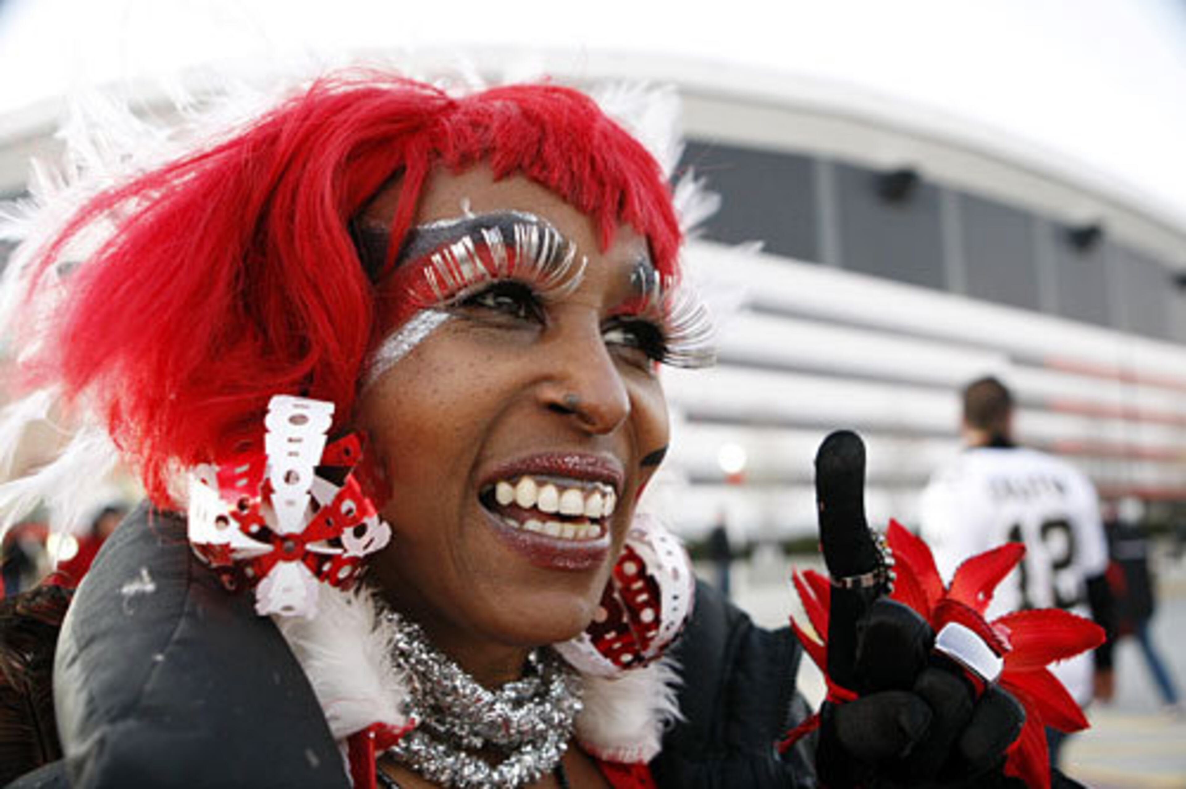 The "Atlanta Falcon Bird Lady" Carolyn Freeman, of Macon, lets Saints fans know who is number 1.