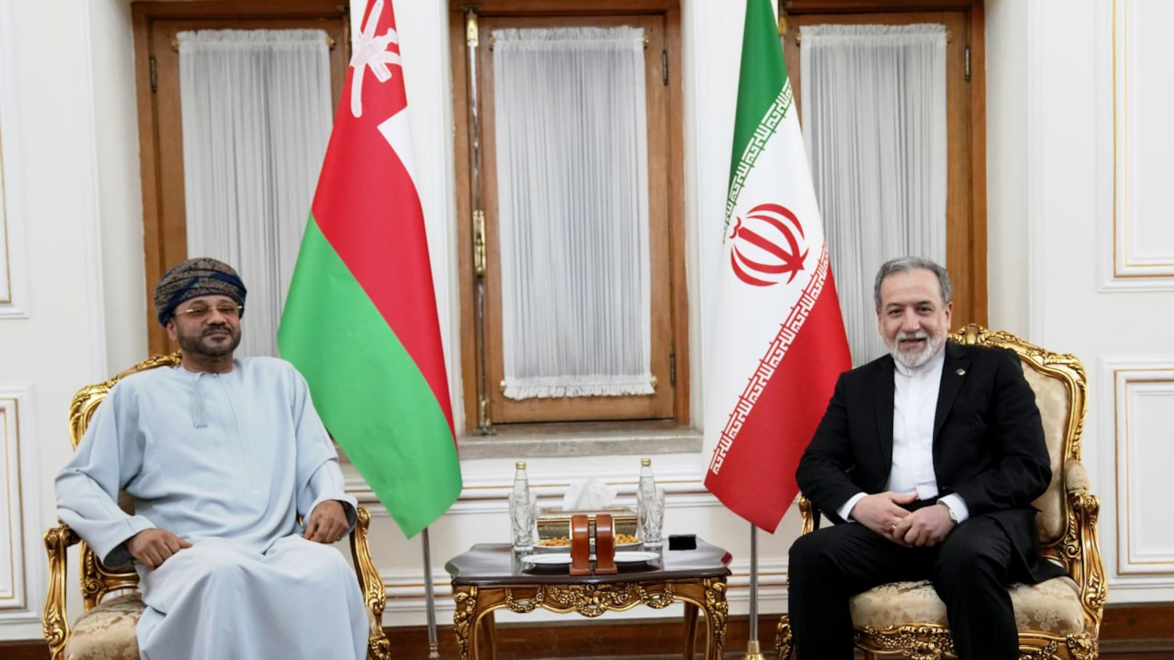 In this photo released by the Iranian Foreign Ministry, Foreign Minister Abbas Araghchi, right, meets his Omani counterpart Sayyid Badr Albusaidi in Tehran, Iran, Tuesday, Aug. 25, 2026. (Iran's Foreign Ministry, via AP)
