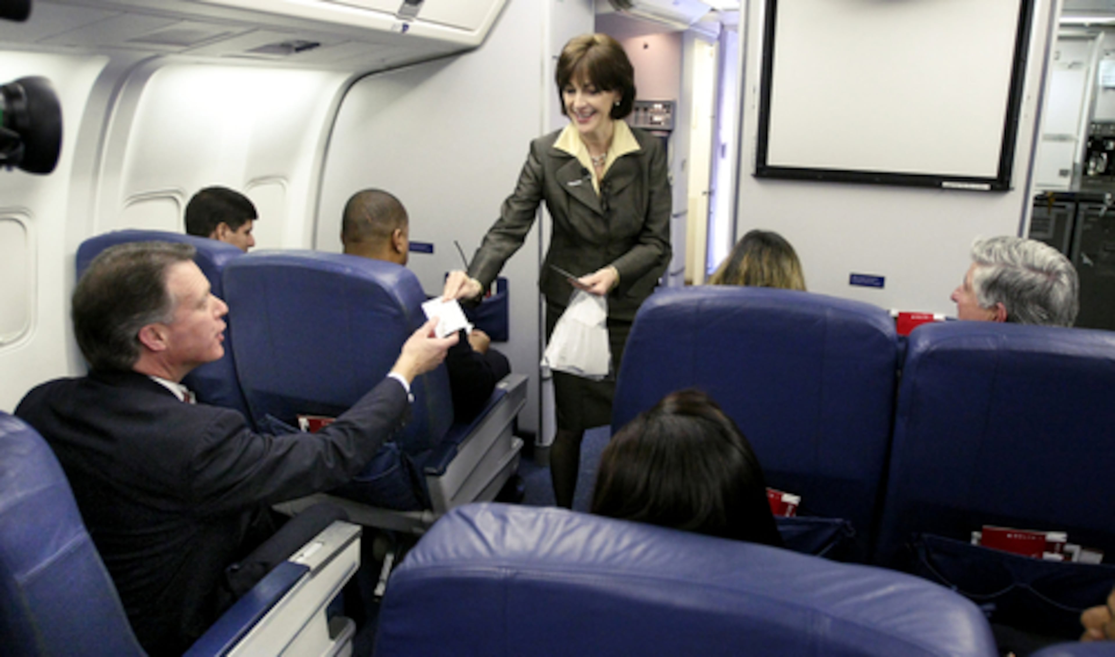 On Valentine's Day 2008 Delta employee Chris Wells (left), seated on a 767, receives a congratulatory pin from Joanne Smith, Delta's Senior Vice President, In Flight Services and Global Product Development, at Hartsfield-Jackson International Airport. Delta employees world wide collectively received $158 million dollars on in profit sharing in mid February, recognizing their crucial role in achieving financial and operational goals.