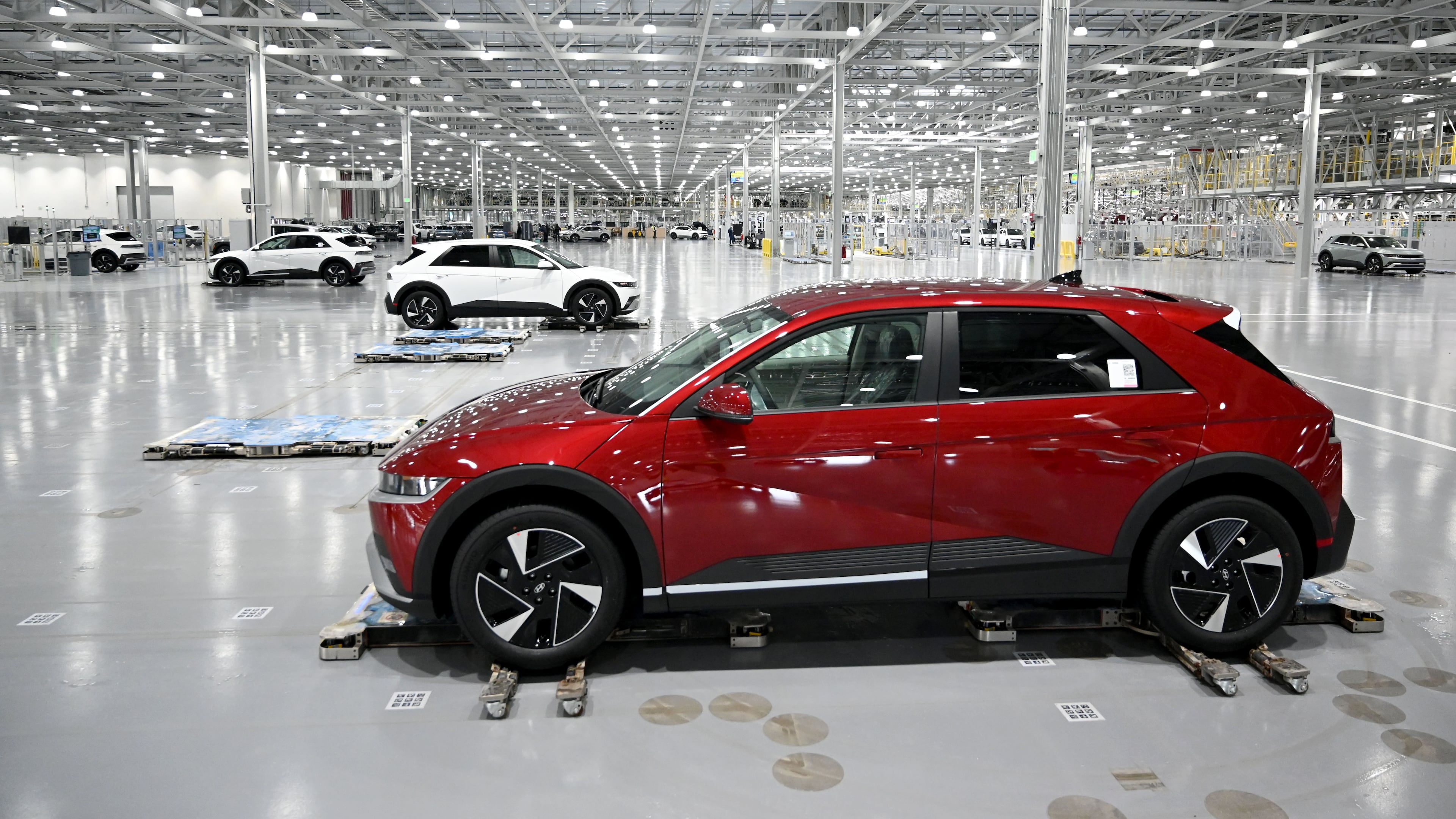 Hyundai IONIQ 5 electric vehicles are transported by autonomous mobile robots at the final stage of the assembly line at Hyundai Motor Group Metaplant America (HMGMA) on Wednesday, May 6, 2026, in Ellabell, Georgia. Hyundai Metaplant behind-scenes-tour as the plant prepares to start a second shift and a second production line. Plant tour and interview with top plant officials. (Hyosub Shin/AJC)