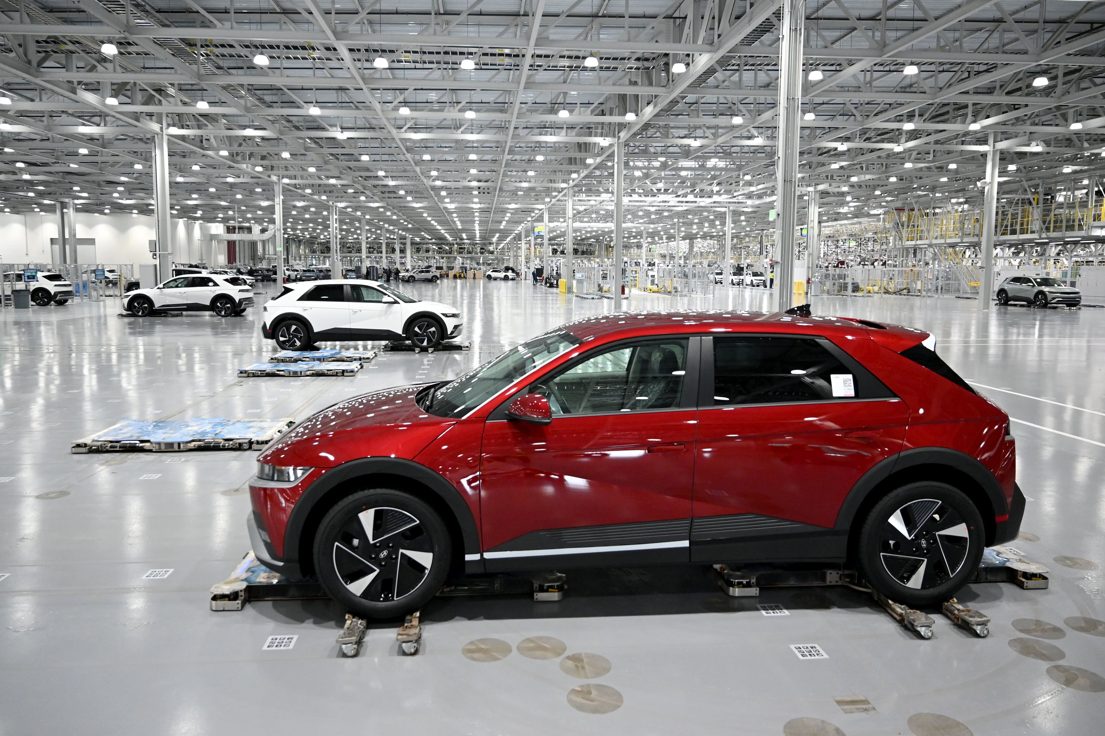 Hyundai IONIQ 5 electric vehicles are transported by autonomous mobile robots at the final stage of the assembly line at Hyundai Motor Group Metaplant America (HMGMA) on Wednesday, May 6, 2026, in Ellabell, Georgia. Hyundai Metaplant behind-scenes-tour as the plant prepares to start a second shift and a second production line. Plant tour and interview with top plant officials. (Hyosub Shin/AJC)