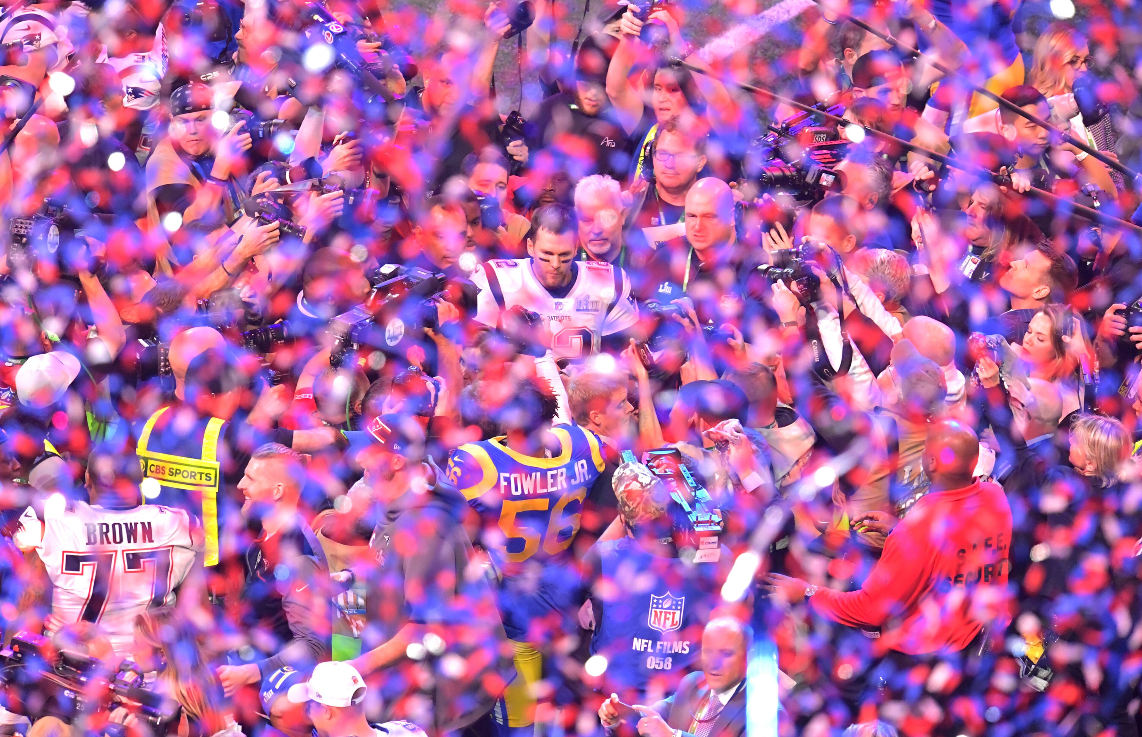 2/3/19 - Atlanta - New England Patriots quarterback Tom Brady (12) is surrounded by members of the media after the New England Patriots won over the Los Angeles Rams in Super Bowl LIII on Sunday, Feb. 3, 2019 at Mercedes-Benz Stadium in Atlanta, Ga. 
 HYOSUB SHIN / HSHIN@AJC.COM