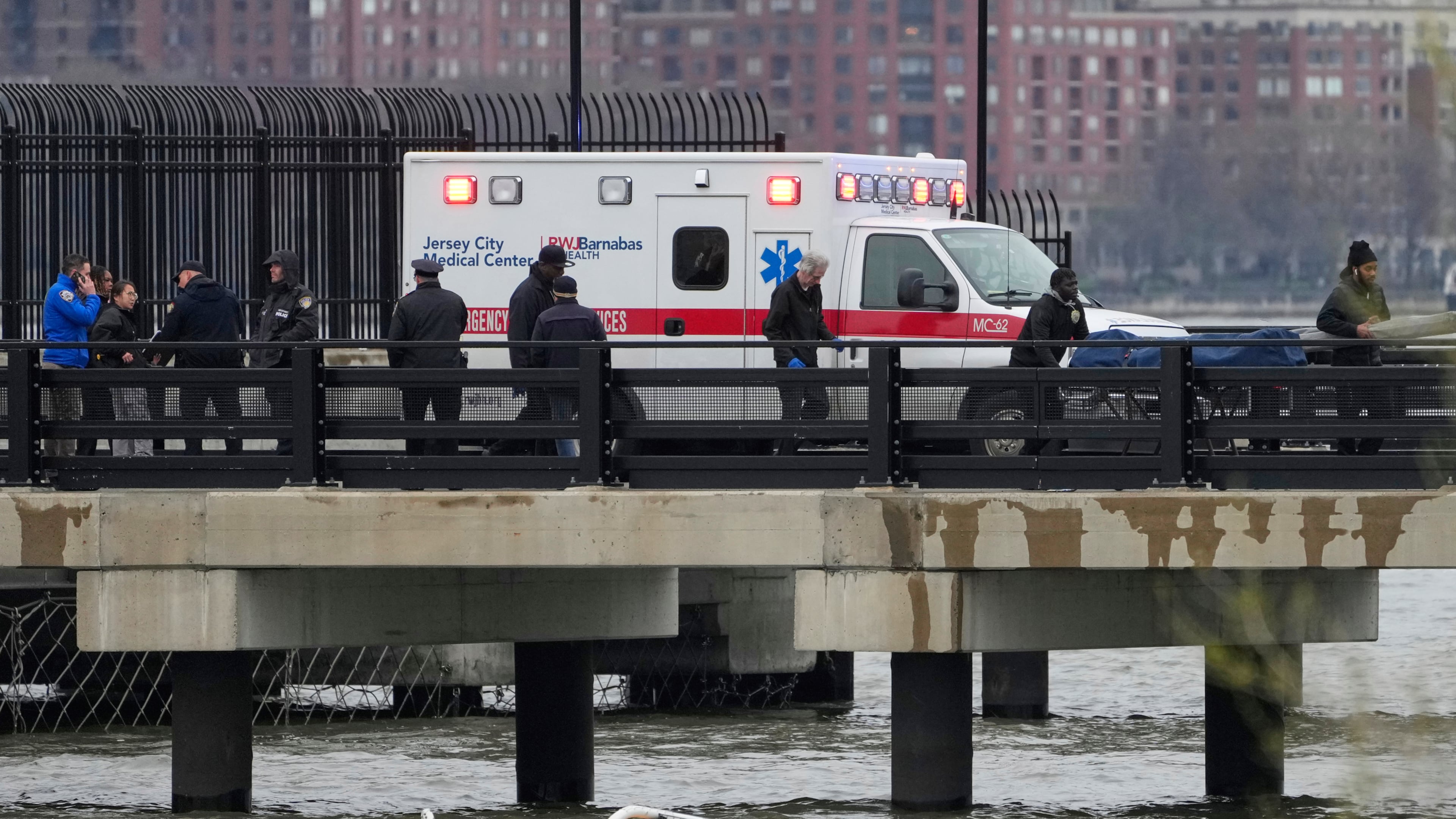 FILE - Emergency personnel respond to a helicopter crash on the Hudson River, April 10, 2025, in Jersey City, N.J. (AP Photo/Seth Wenig, File)