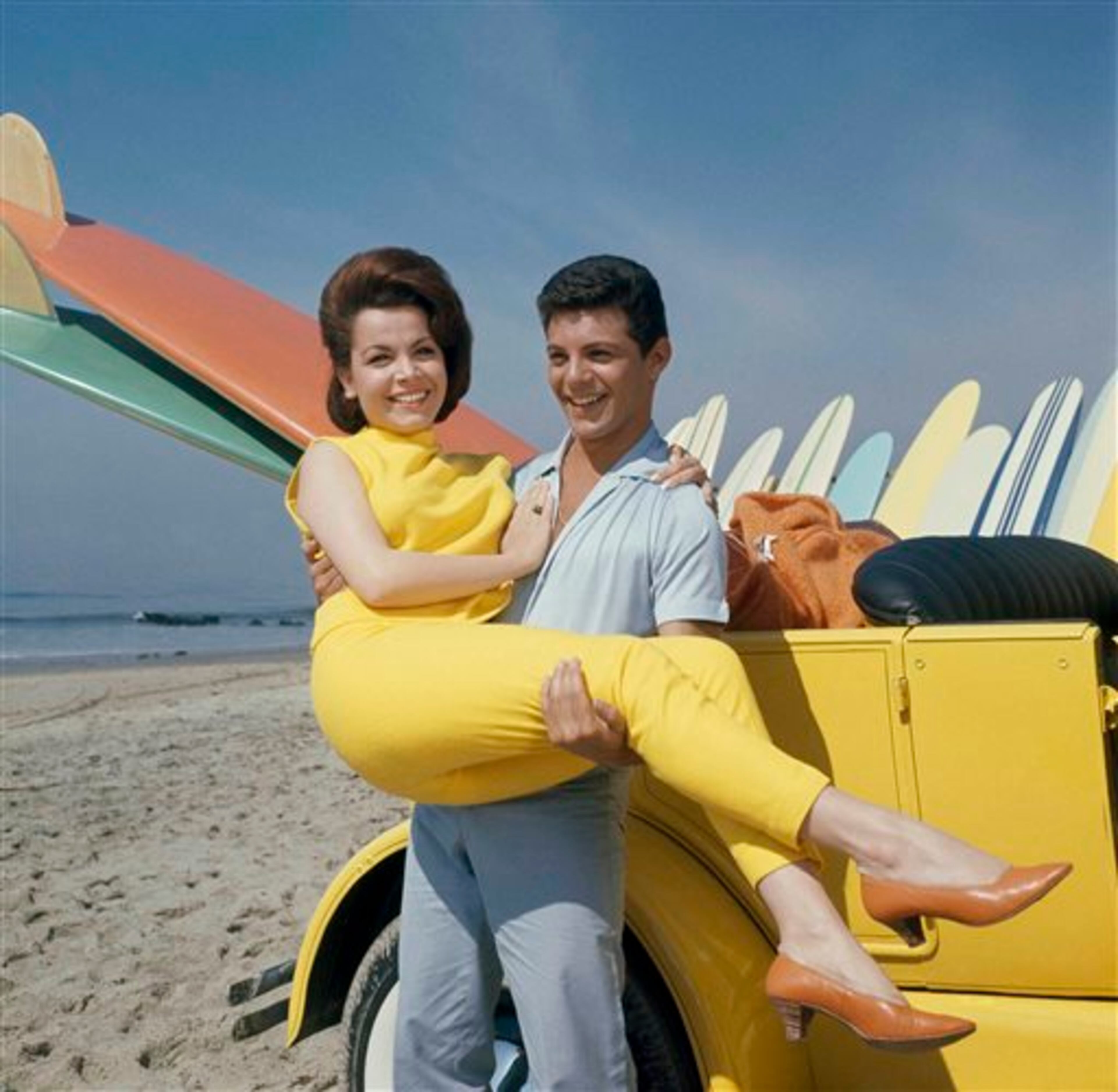 FILE - In this 1963 file photo, singer Frankie Avalon and actress Annette Funicello are seen on Malibu Beach during filming of "Beauty Party," in California in 1963. Walt Disney Co. says, Monday, April 8, 2013, that Funicello, also known for her beach movies with Frankie Avalon, has died at age 70. (AP Photo/File)