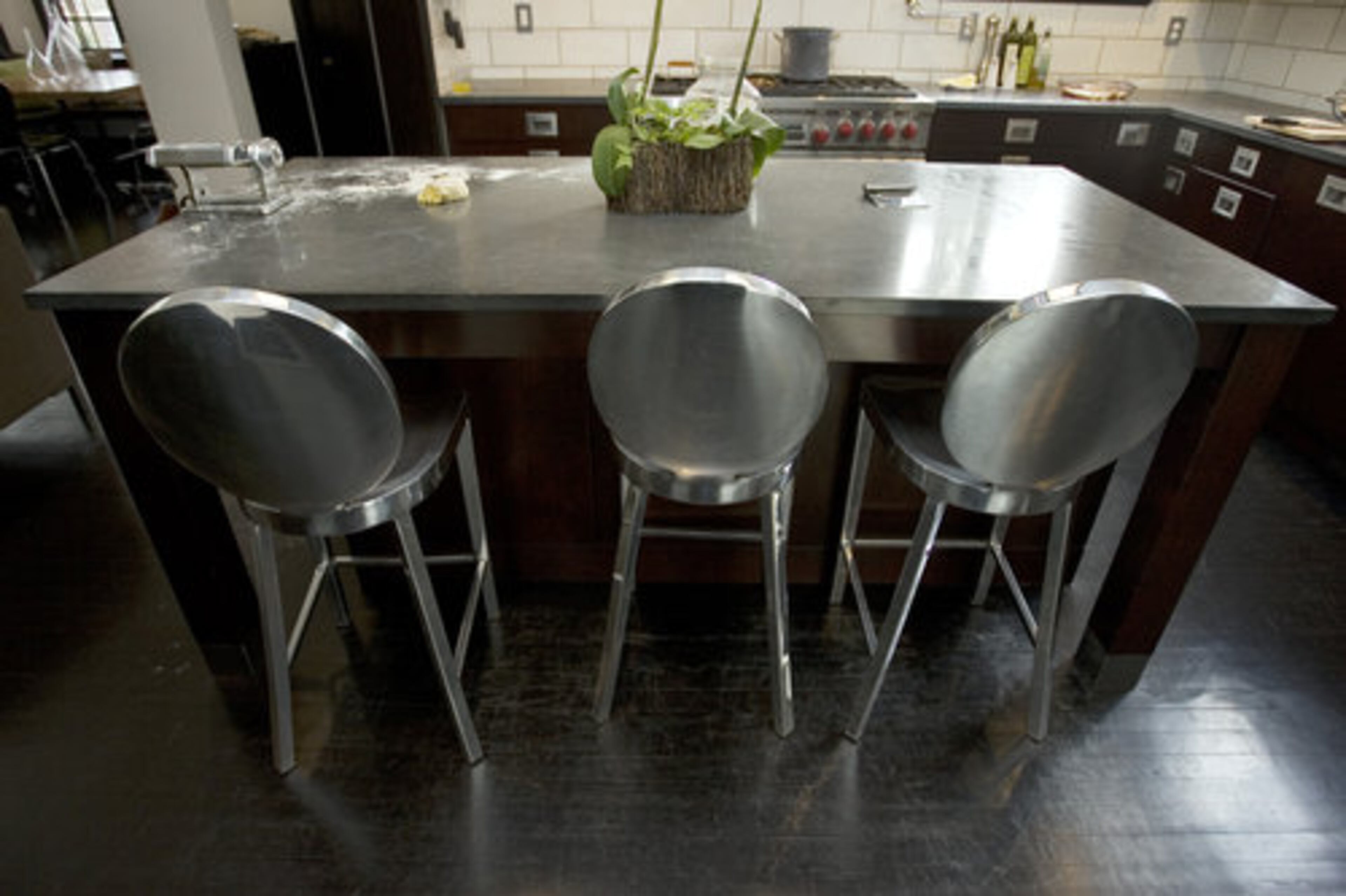The kitchen has several unique items that sets it apart from others. The dining area has aluminum Emeco Kong chairs designed by Philippe Starck.