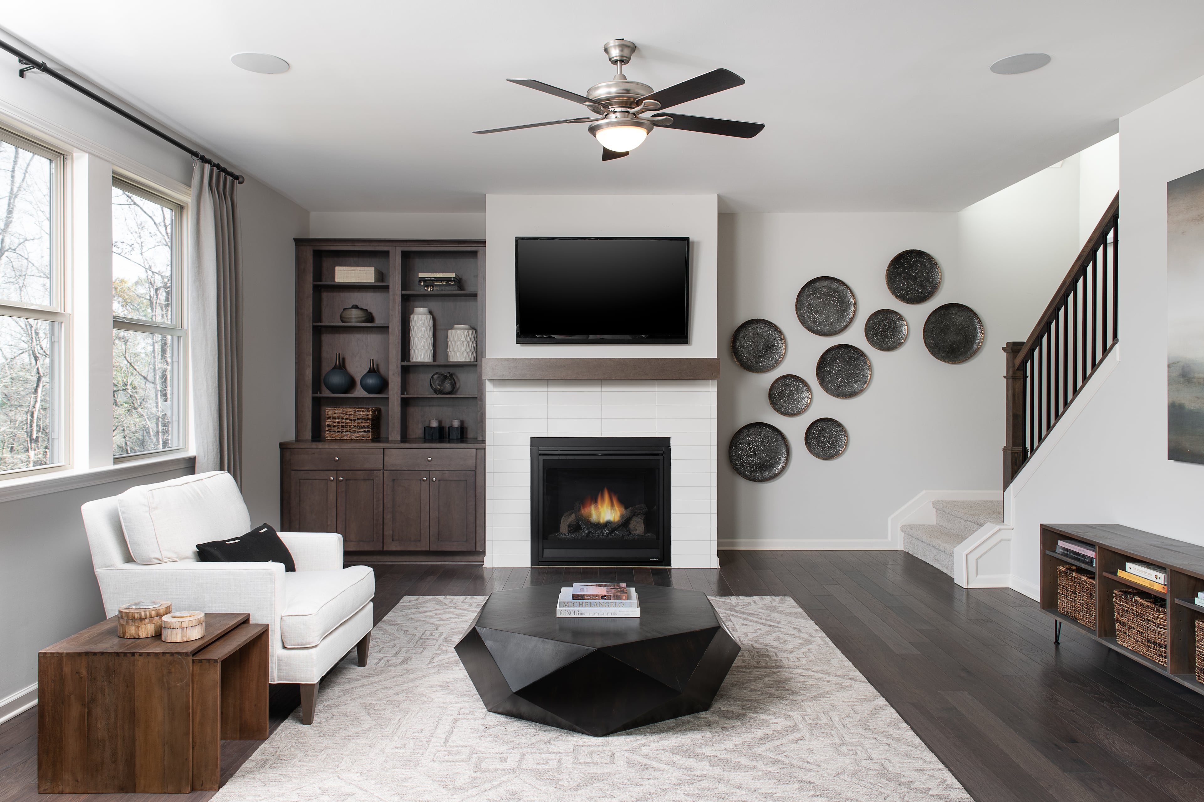 Contrasting fireplace and built-in shelves in family room of the Hampstead model in the Ashton Woods community of Brookview in Atlanta. Courtesy of Jason Jones Photography for Ashton Woods Homes