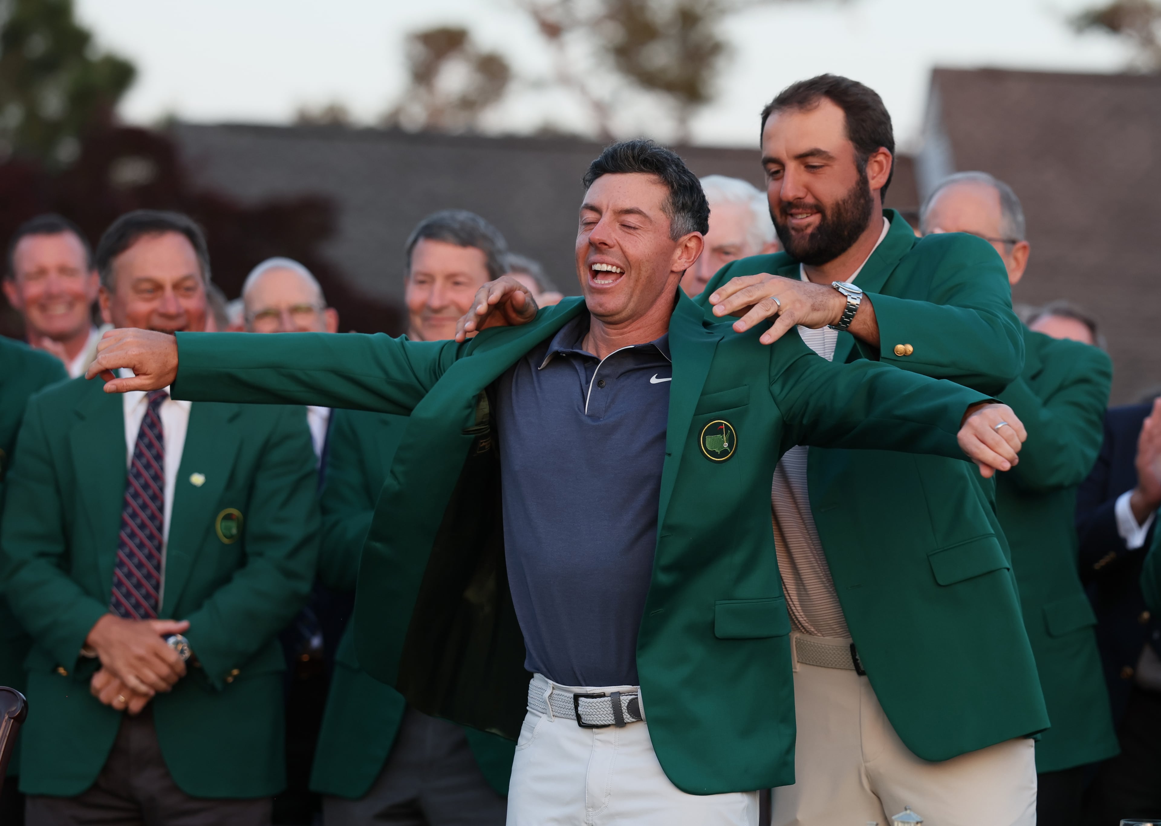 Jon Rahm, 2024 Masters champion, places green jacket on 2025 winner Rory McIlroy at Augusta National Golf Club, Sunday, April 13, 2025, in Augusta, Ga. (Hyosub Shin / AJC)