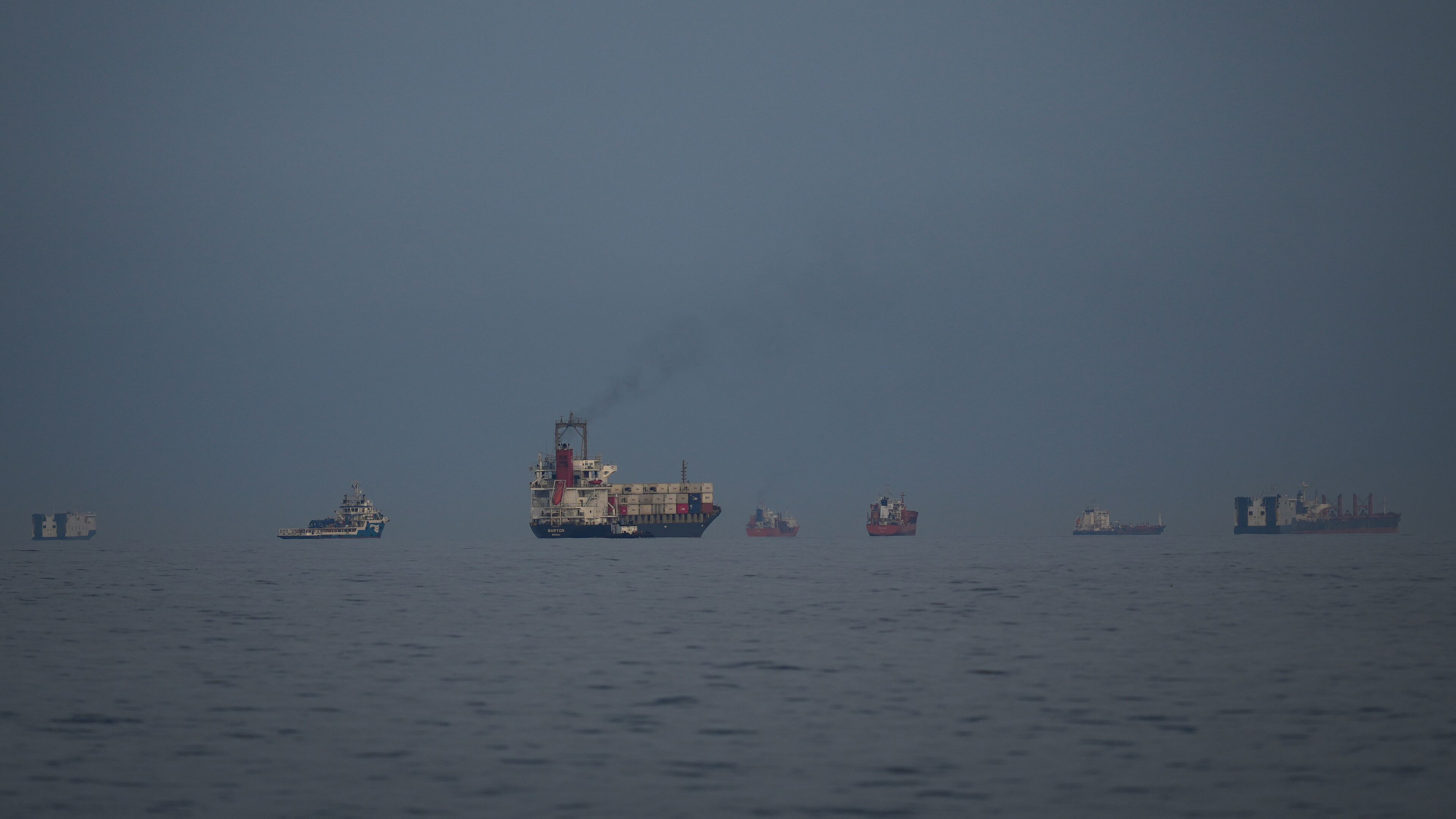 Oil tankers and cargo ships line up in the Strait of Hormuz as seen from Khor Fakkan, United Arab Emirates, Wednesday, March 11, 2026. (AP Photo/Altaf Qadri)
