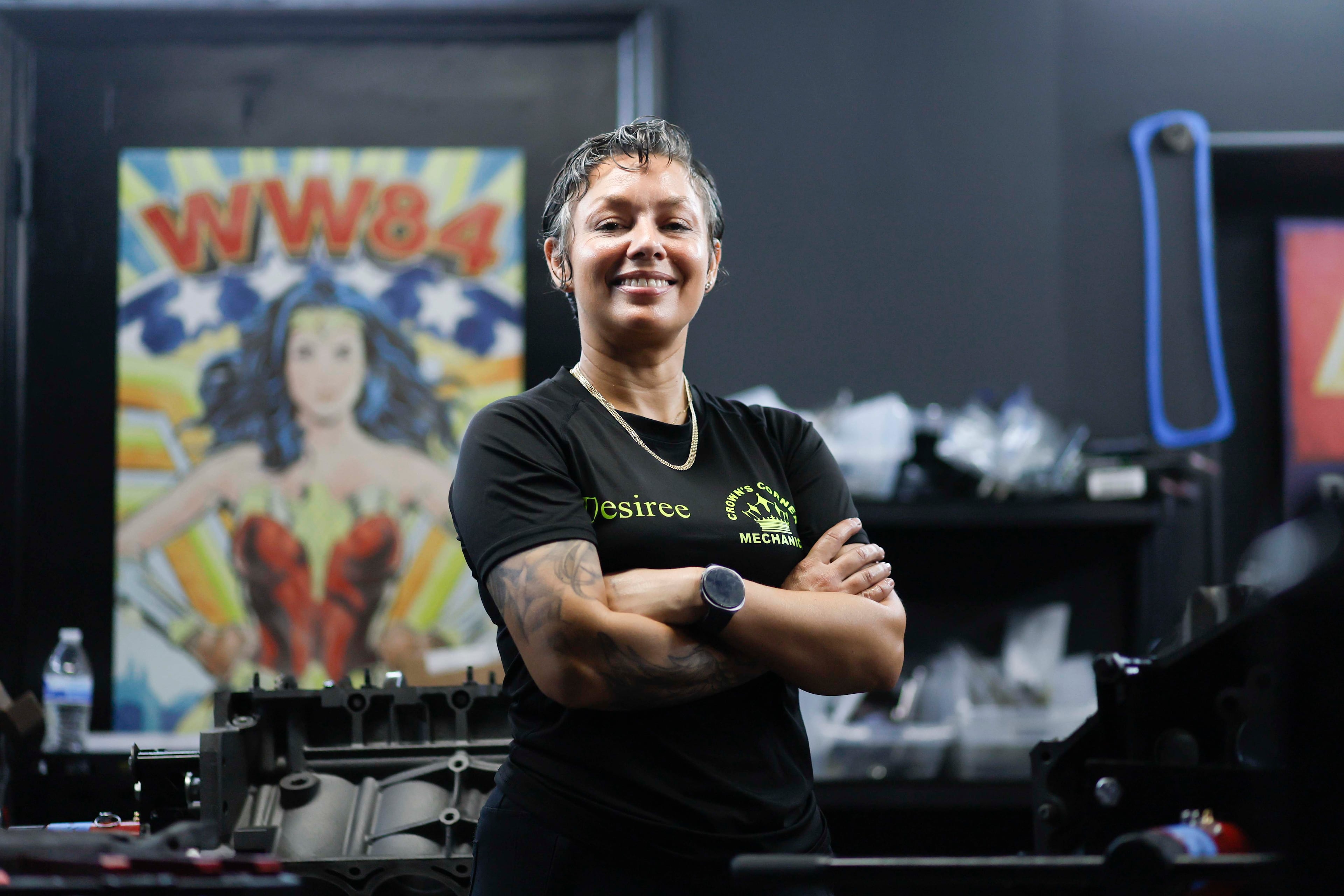 Desiree White, owner of Crown’s Corner Mechanics, stands in the engine room where she has five machines working simultaneously on Thursday, June 4, 2026. The shop offers general mechanic services, but specializes in building vintage car engines. (Miguel Martinez/AJC)