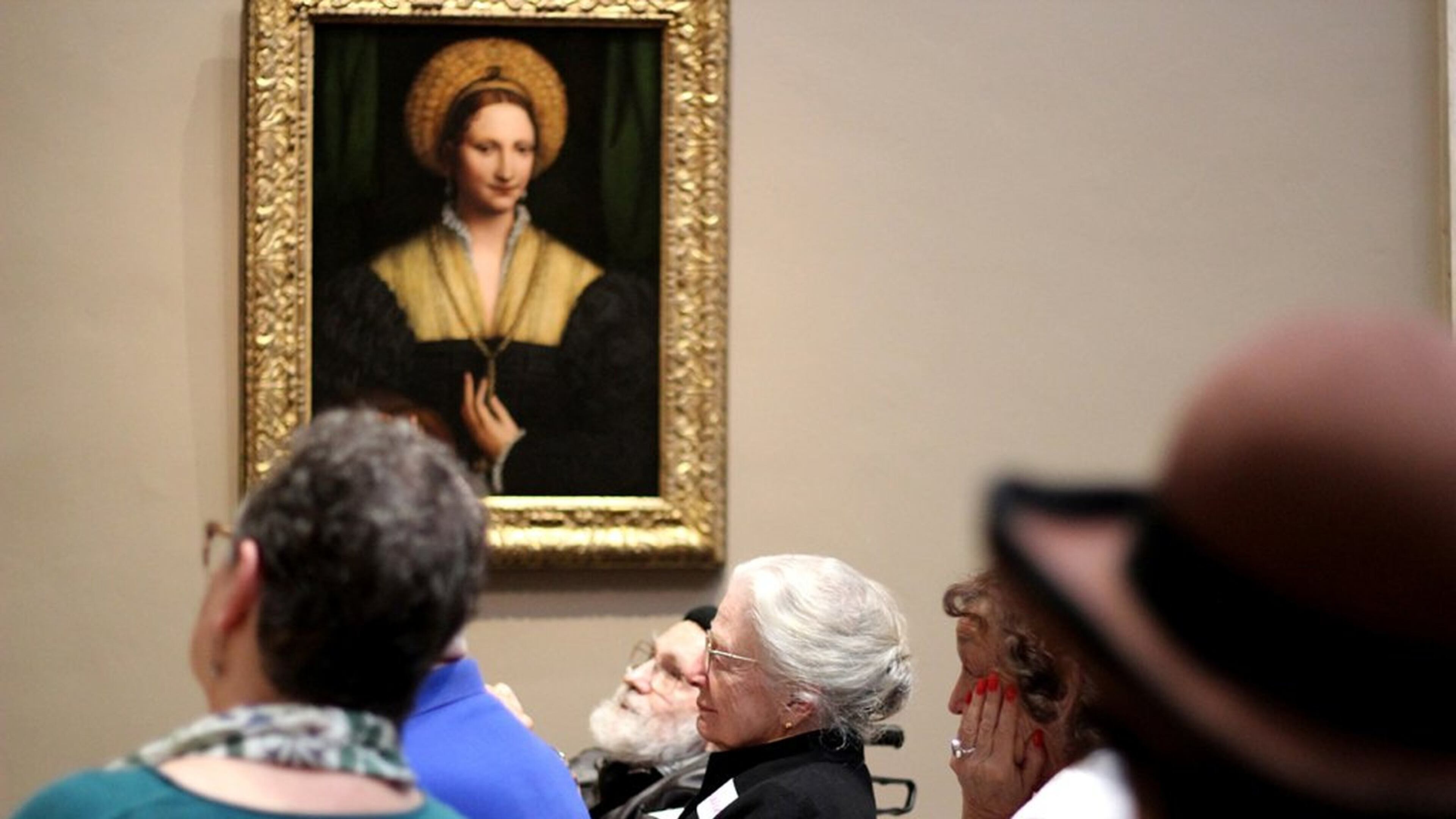 A group of older adults and their caregivers analyze and discuss works of art on March 5, 2018, as part of the National Gallery’s Just Us program in Washington, D.C. (Lynne Shallcross/KHN/TNS)