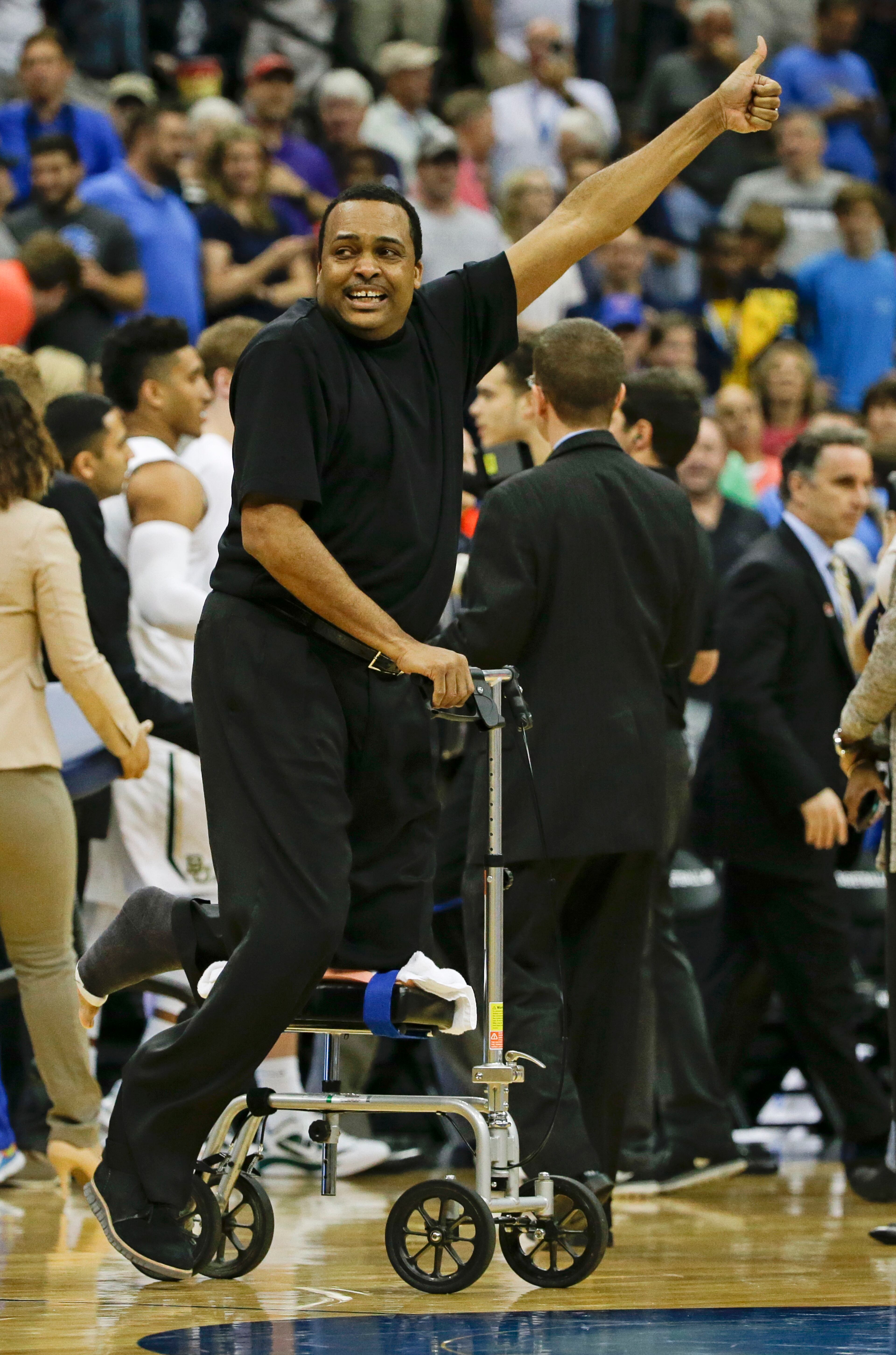 Hunter celebrates as he goes on the court after defeating Baylor 57-56 Thursday. (AP Photo/Chris O'Meara)