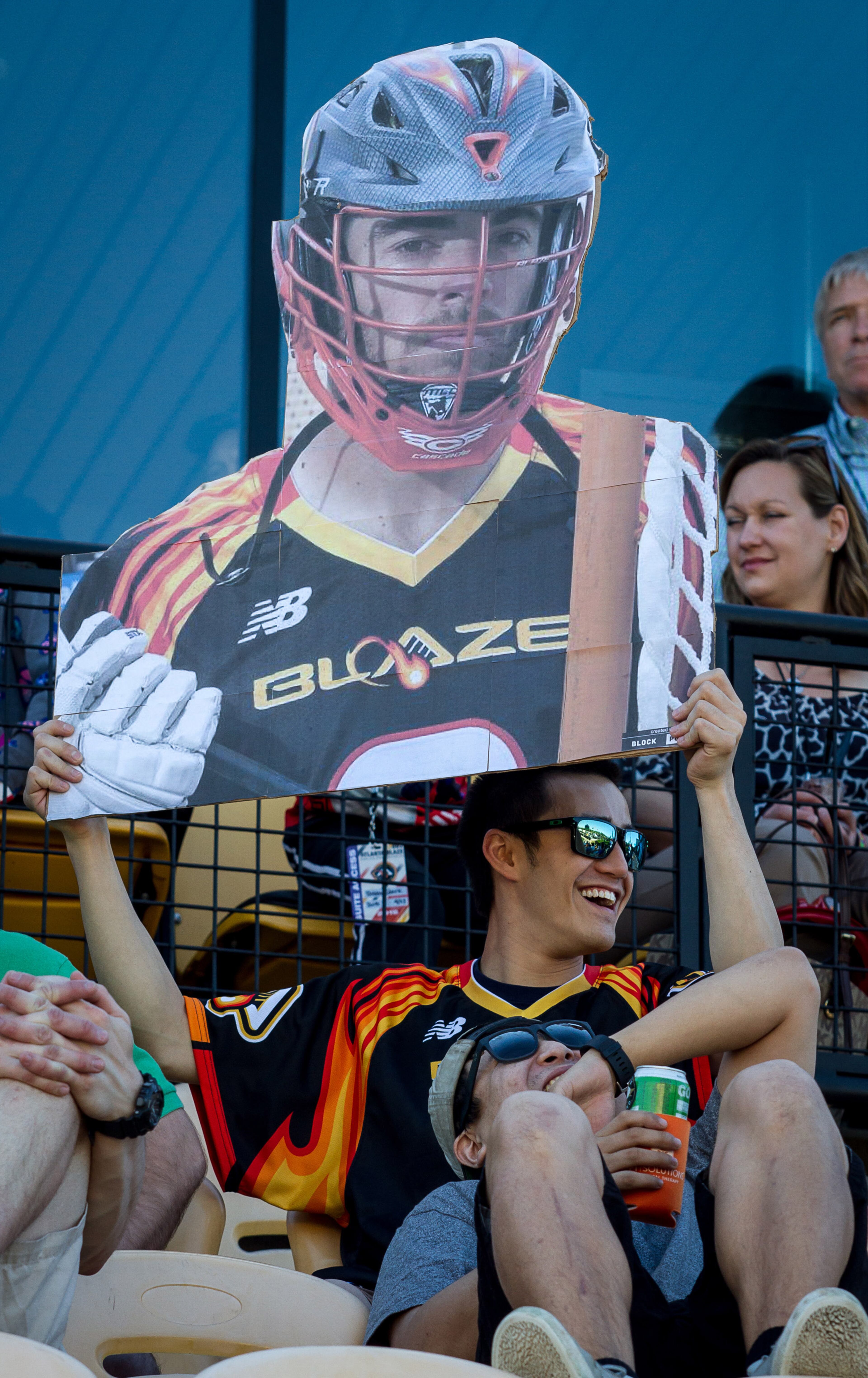 Emil Brignola holds up a photo of his favorite Atlanta Blaze player during the Blaze's inaugural game Saturday night April 23, 2016 in Kennesaw, Ga. STEVE SCHAEFER / SPECIAL TO THE AJC