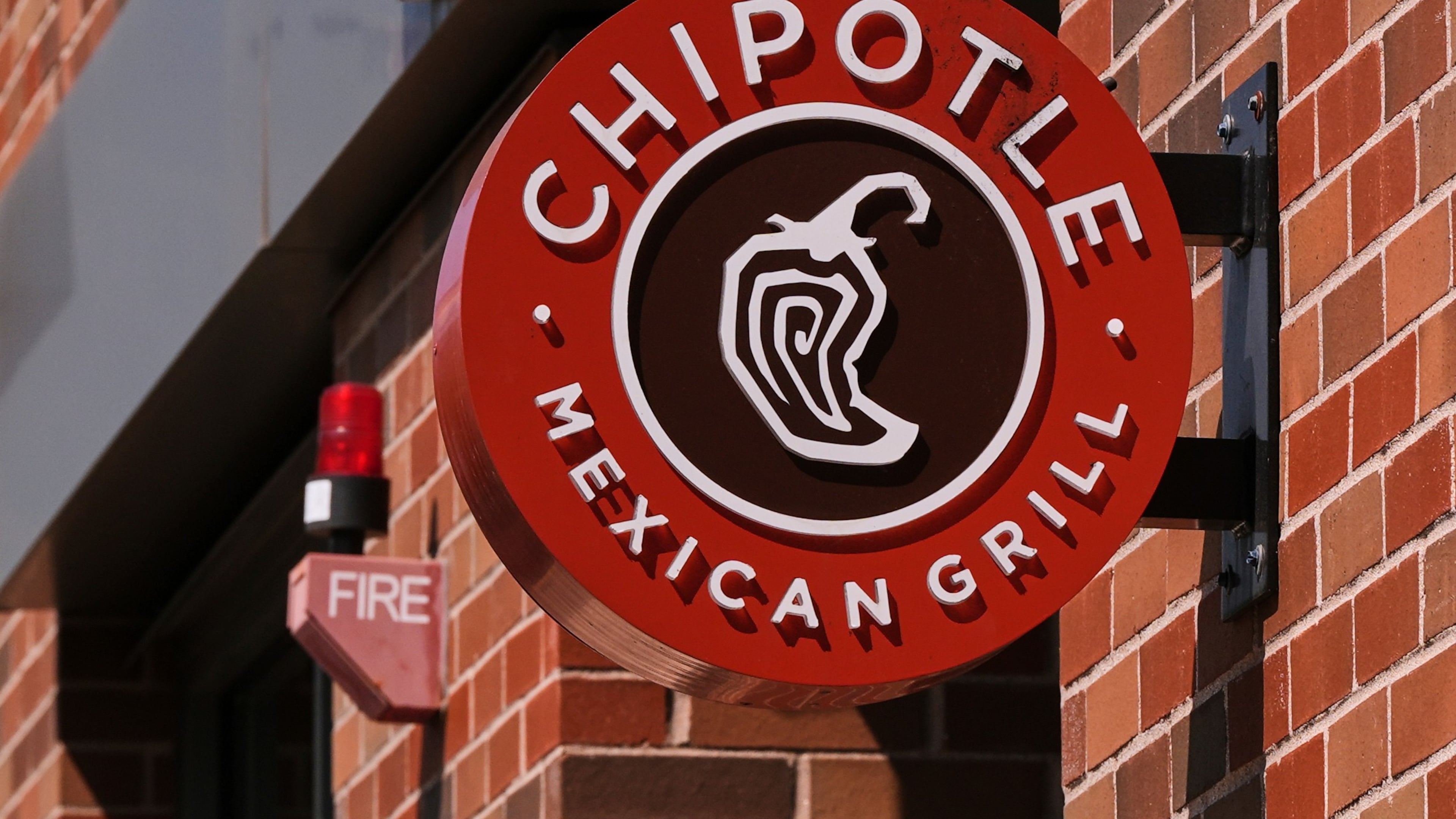 FILE - The Chipotle logo is displayed at a store, Aug. 13, 2025, in Newton, Mass. (AP Photo/Charles Krupa, File)