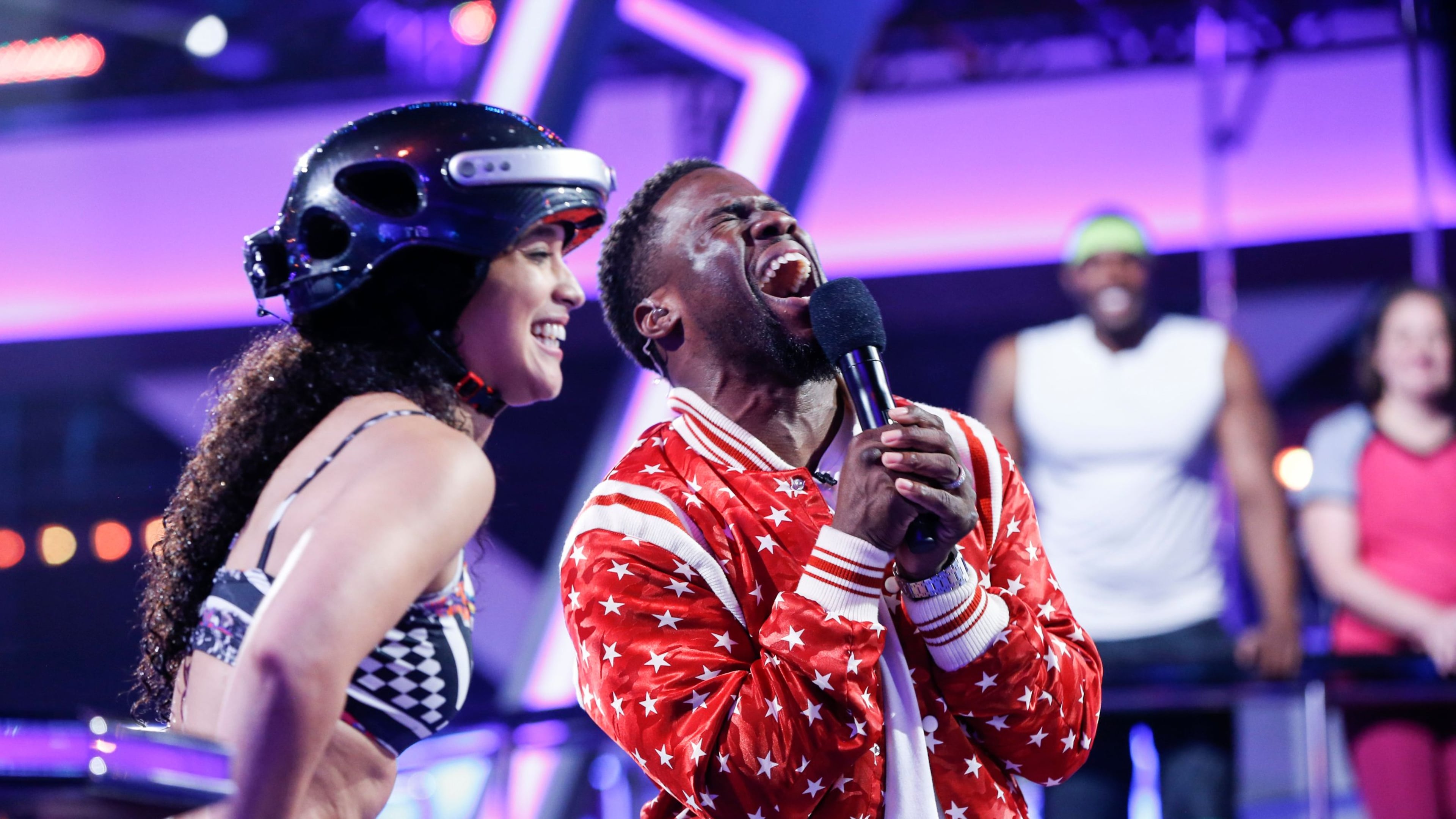 "Unsung Heroes" -- Pictured: Yesenia "Jeszie" Geronimo and Kevin Hart. Five unsung heroes compete in TKO: TOTAL KNOCK OUT, a new one-hour obstacle course competition series hosted by Kevin Hart, on the season premiere, Wednesday, July 11 (9:00 -- 10:00 PM, ET/PT) on the CBS Television Network. In an effort to finish the course with the fastest time and win the $50,000 prize, one contestant races through daunting obstacles while four other contestants man battle stations along the course, firing over-the-top projectiles in attempt to knock them off and slow them down.